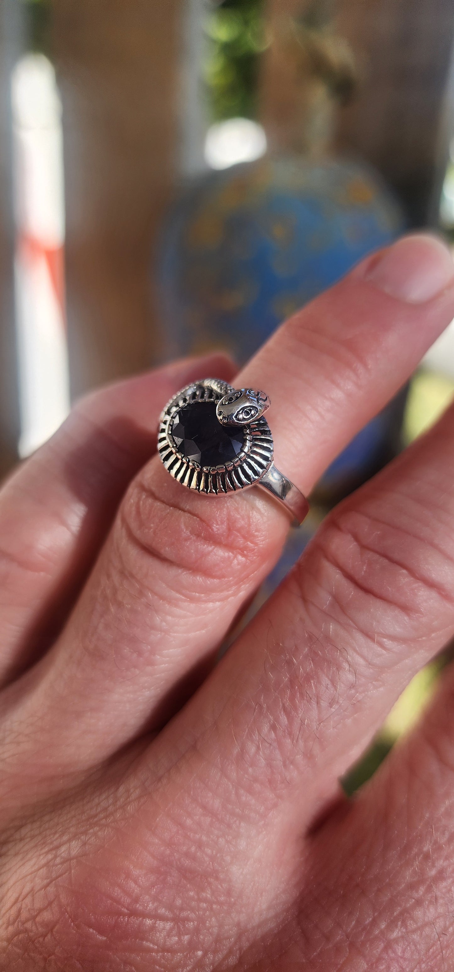 "Whispers of the Sapphire Serpent"
This sterling silver ring is like a mysterious legend coiled delicately around your finger! At its heart sits a deep blue oval-cut sapphire, faceted to perfection, glowing like a hidden midnight lake under a starlit sky.