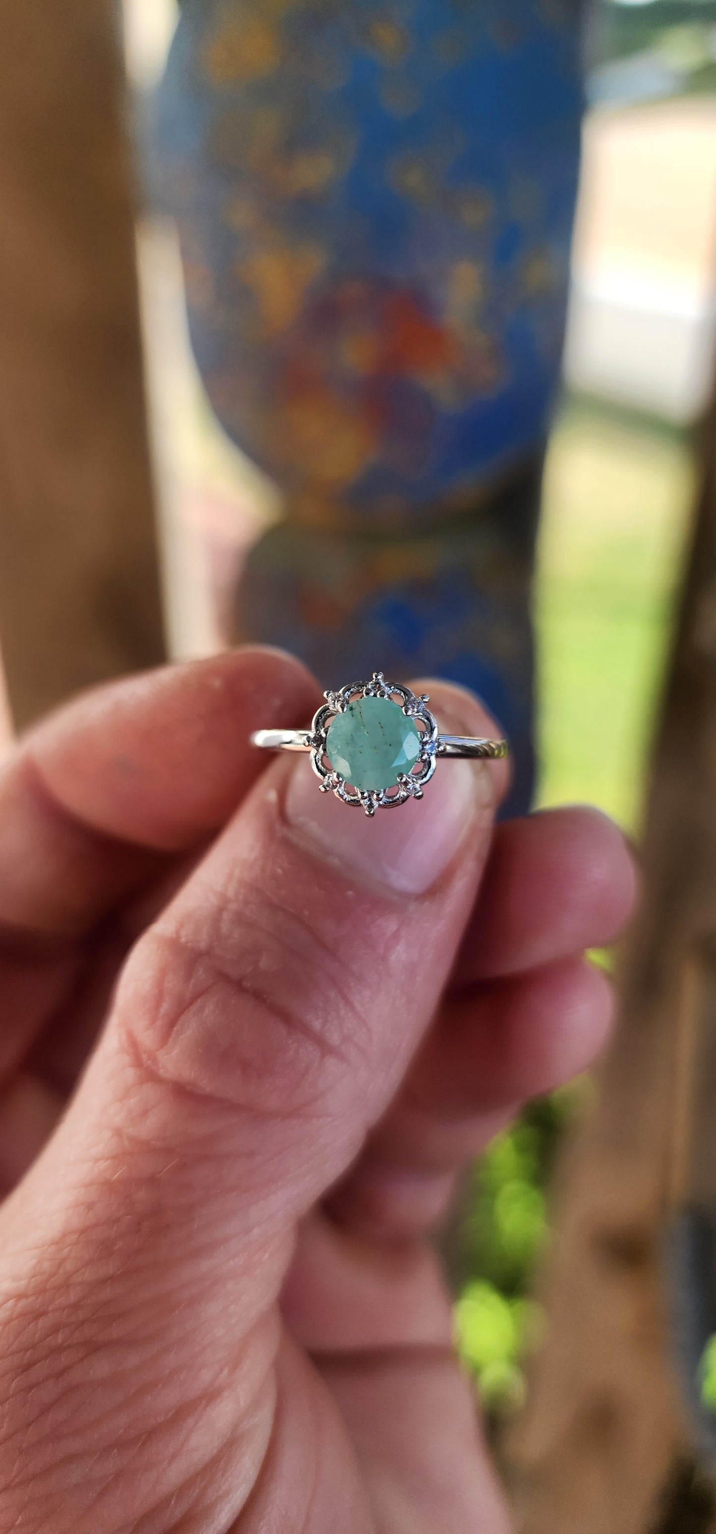 Delicate, graceful, and utterly enchanting — this ring is a dainty drop of nature's magic. Crafted in luminous sterling silver and finished with a sleek rhodium plating, the slender band draws your gaze directly to the star of the show!