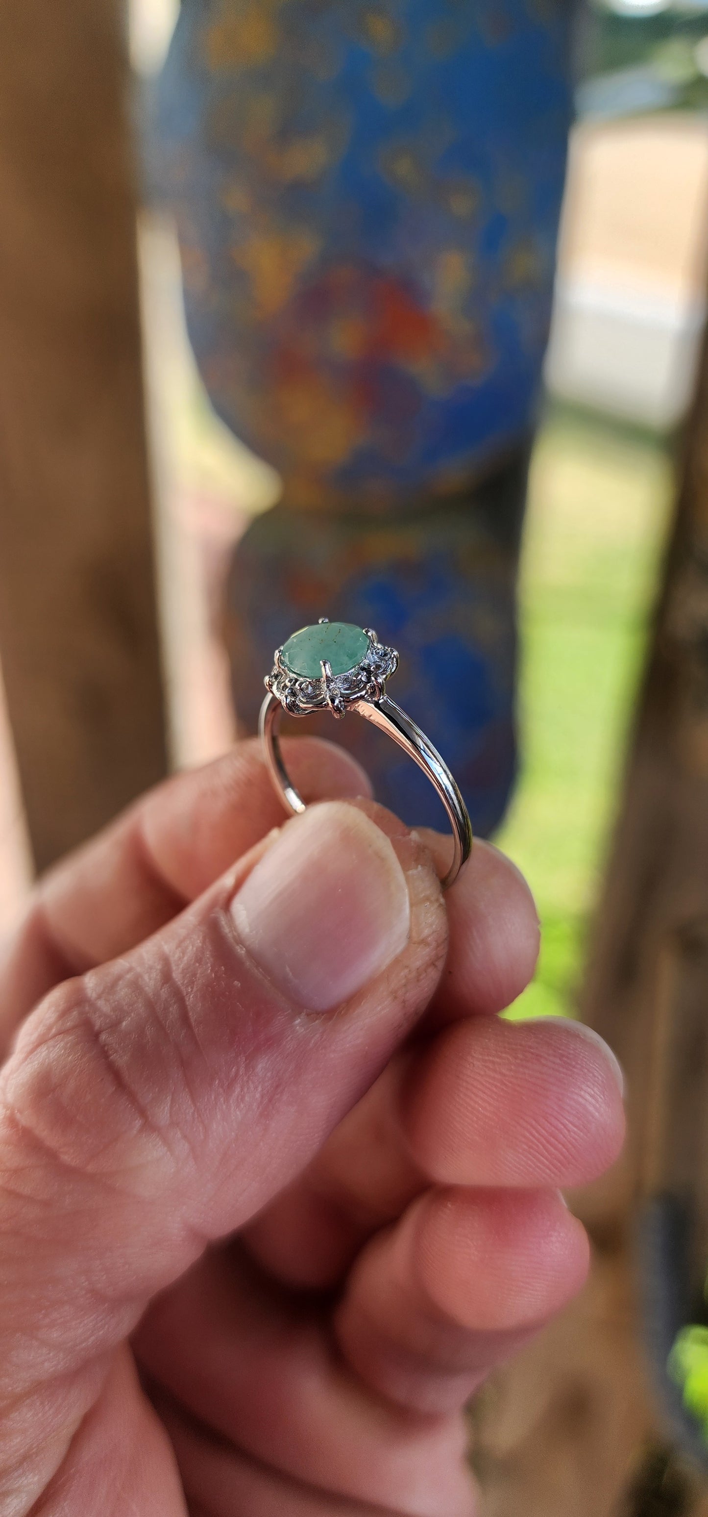 Delicate, graceful, and utterly enchanting — this ring is a dainty drop of nature's magic. Crafted in luminous sterling silver and finished with a sleek rhodium plating, the slender band draws your gaze directly to the star of the show!