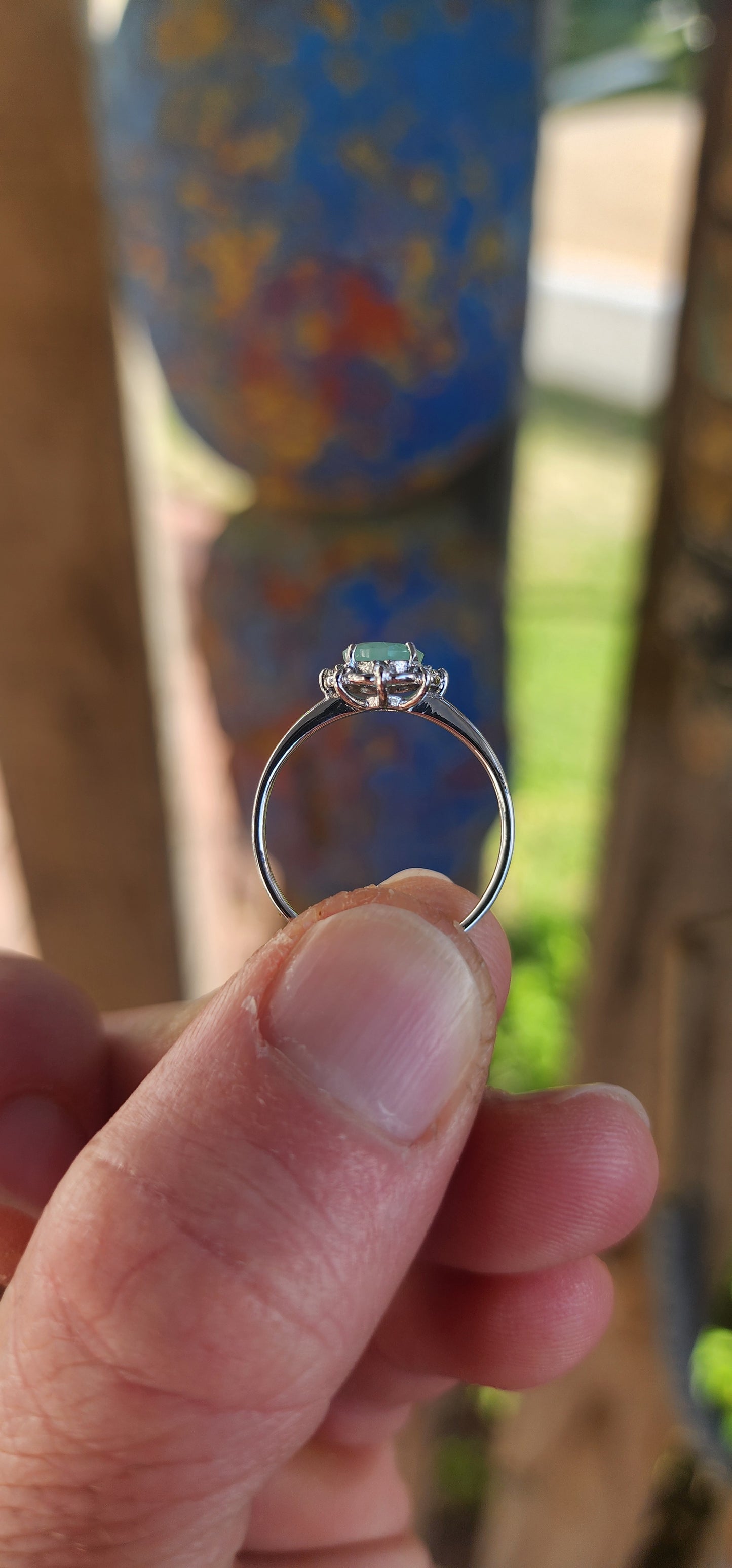 Delicate, graceful, and utterly enchanting — this ring is a dainty drop of nature's magic. Crafted in luminous sterling silver and finished with a sleek rhodium plating, the slender band draws your gaze directly to the star of the show!
