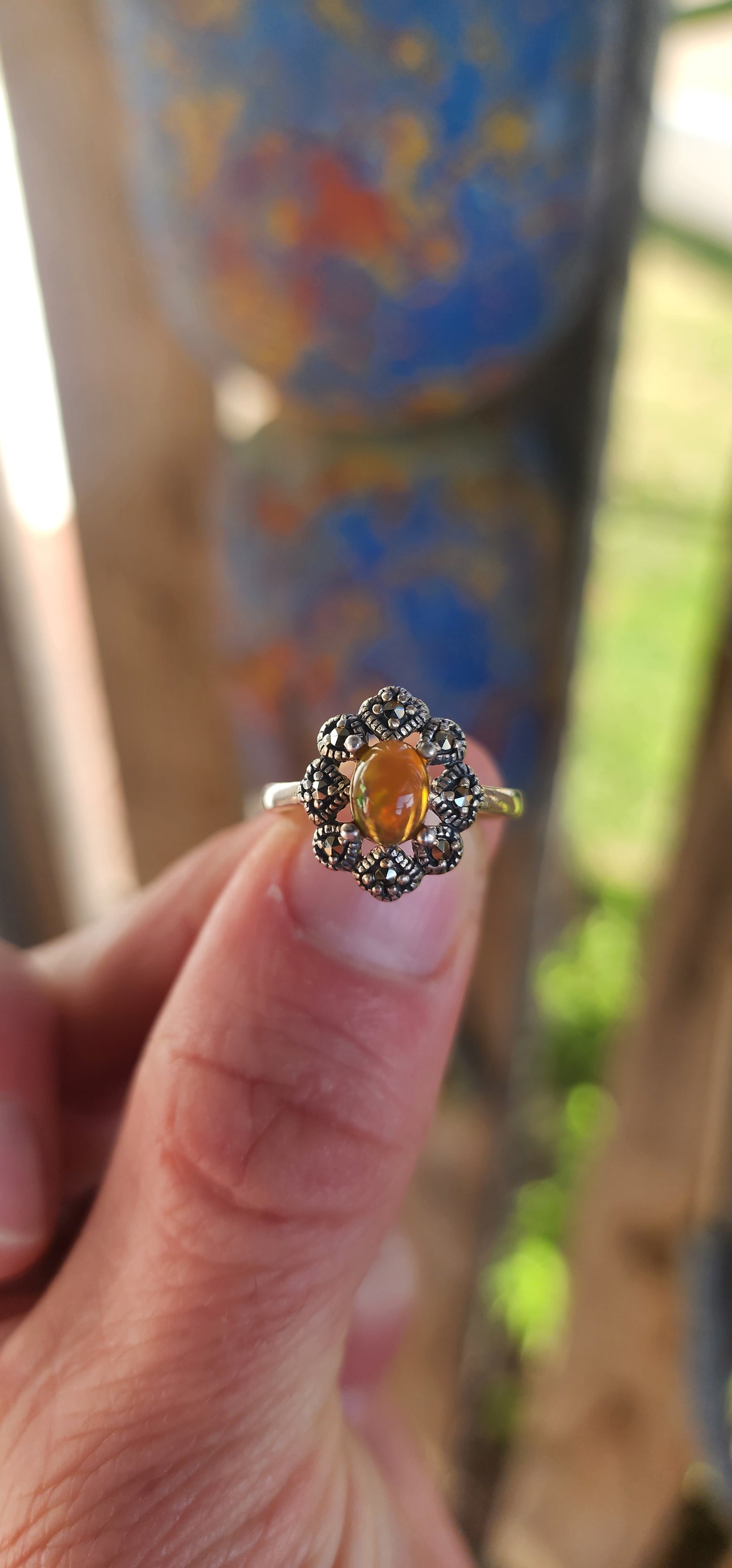 This vintage-inspired beauty is like a whispered love letter from another era, where craftsmanship was poetry and gemstones carried stories. Cast in glowing sterling silver, the ring gently cradles an exquisite oval Ethiopian opal cabochon.