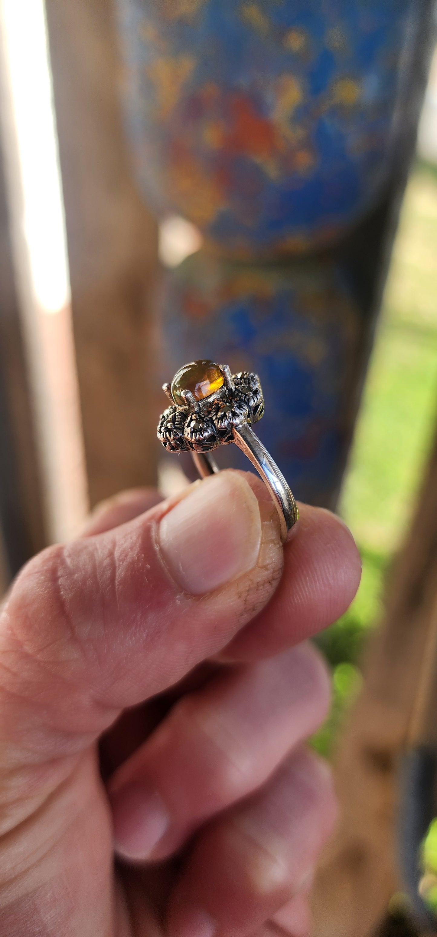 This vintage-inspired beauty is like a whispered love letter from another era, where craftsmanship was poetry and gemstones carried stories. Cast in glowing sterling silver, the ring gently cradles an exquisite oval Ethiopian opal cabochon.