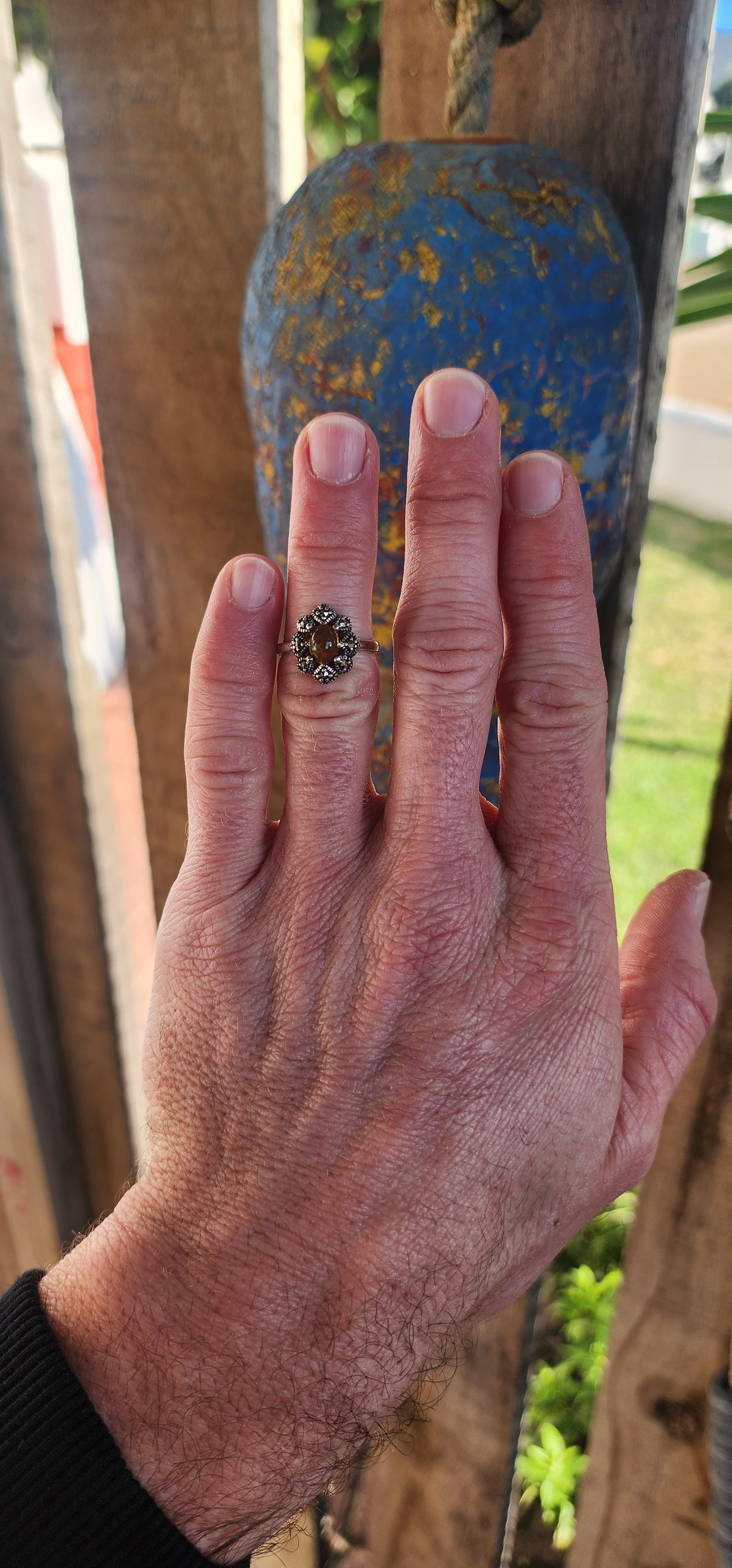 This vintage-inspired beauty is like a whispered love letter from another era, where craftsmanship was poetry and gemstones carried stories. Cast in glowing sterling silver, the ring gently cradles an exquisite oval Ethiopian opal cabochon.
