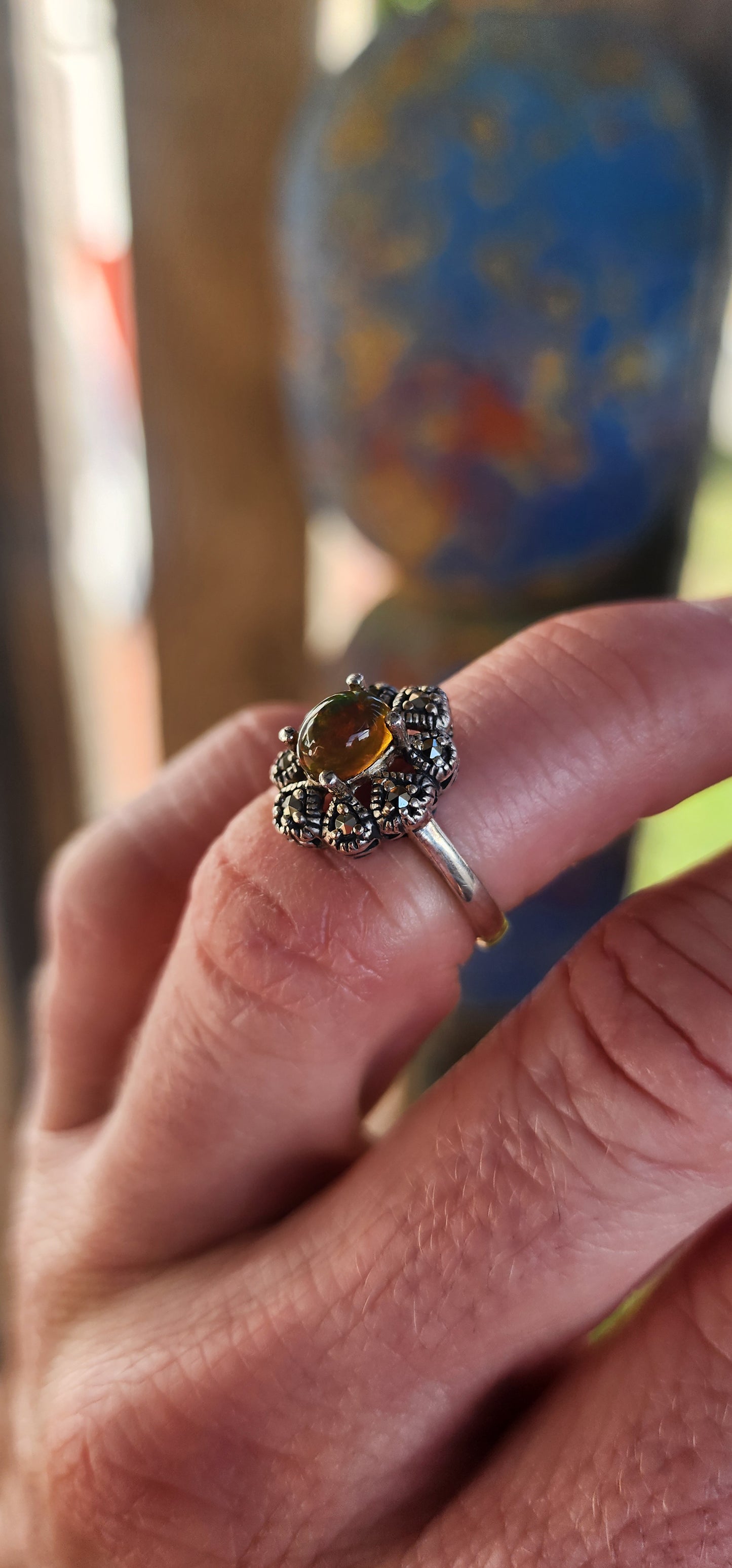 This vintage-inspired beauty is like a whispered love letter from another era, where craftsmanship was poetry and gemstones carried stories. Cast in glowing sterling silver, the ring gently cradles an exquisite oval Ethiopian opal cabochon.
