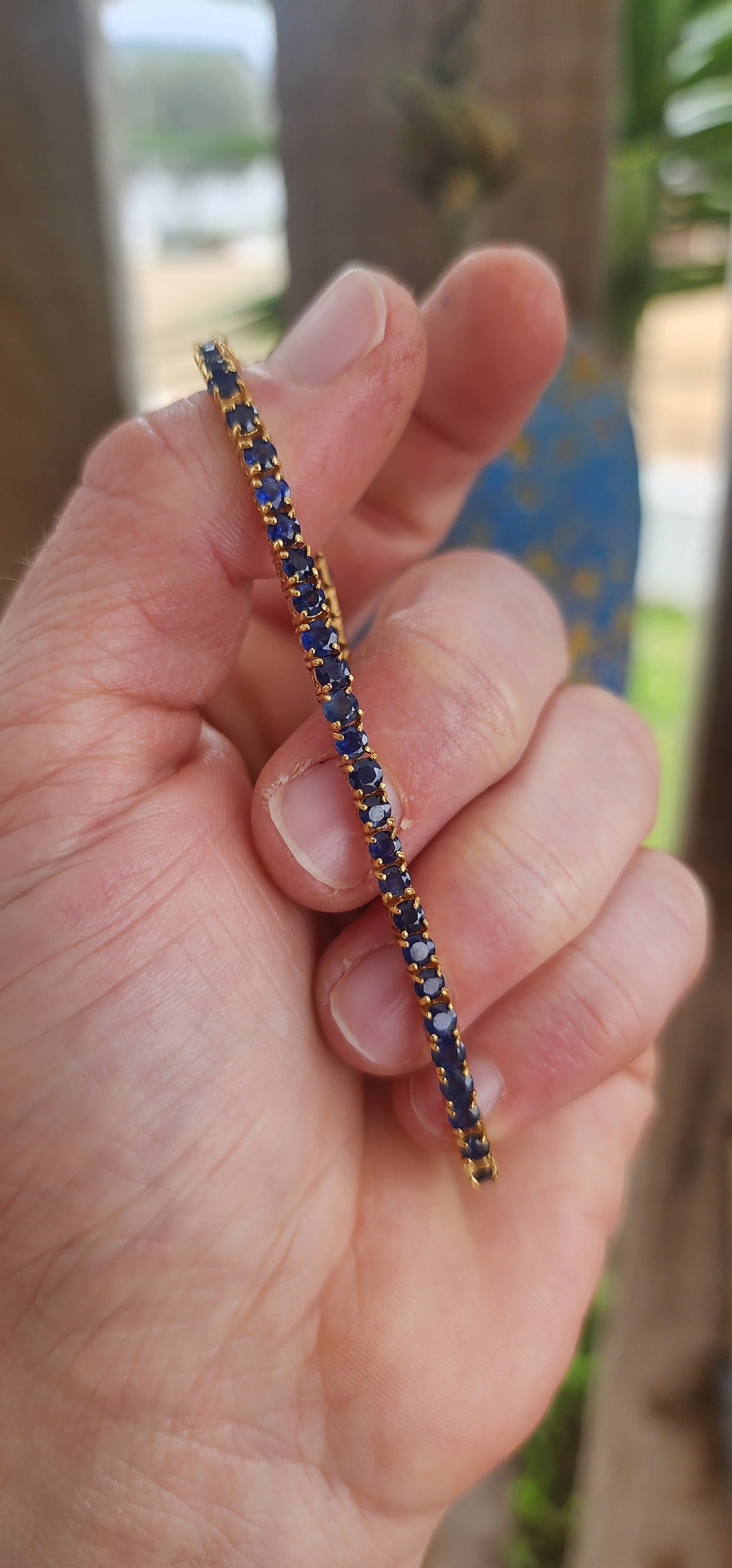 "Midnight Serenade" – A Sapphire Tennis bracelet"
Crafted in gleaming sterling silver and bathed in rich 18ct yellow gold plating.