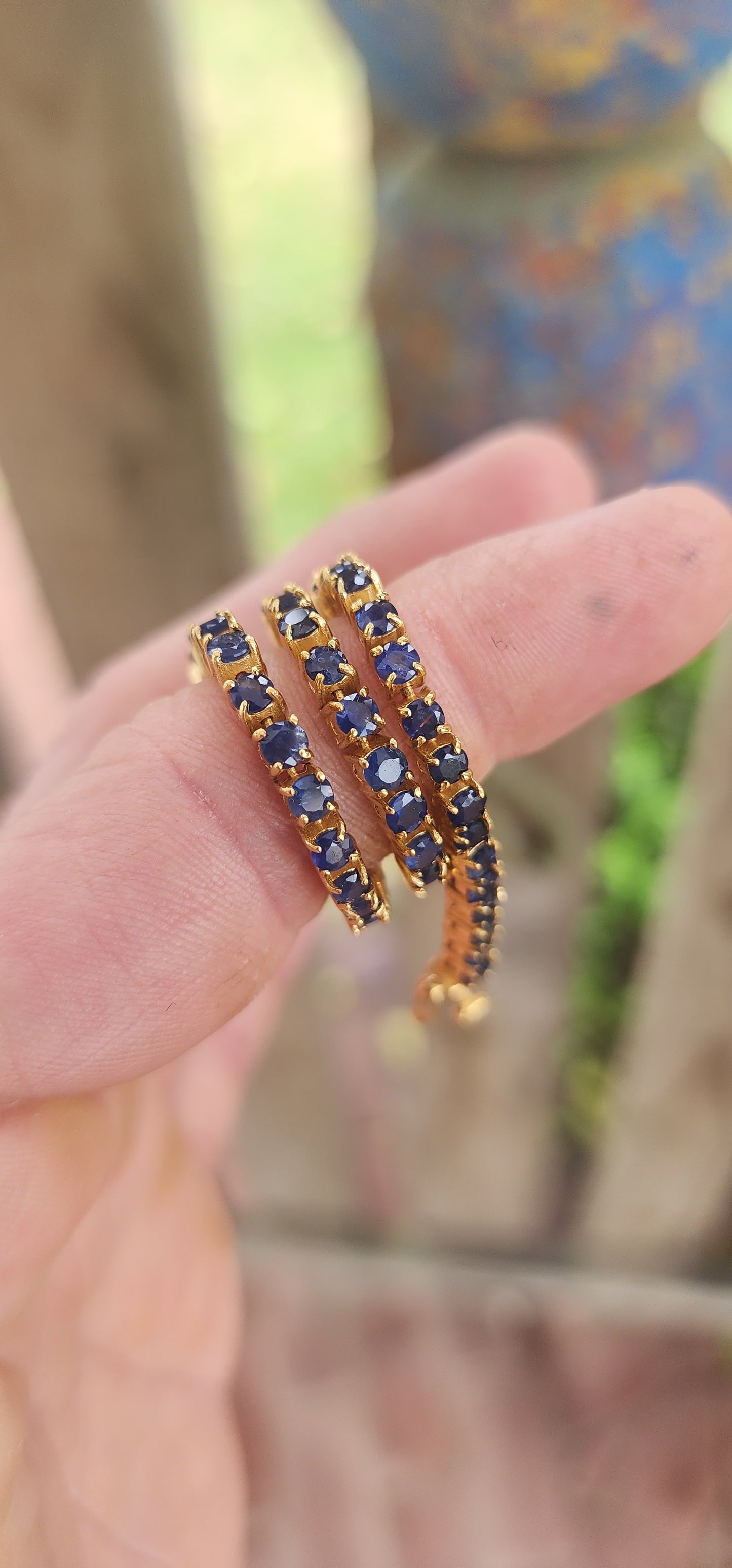 "Midnight Serenade" – A Sapphire Tennis bracelet"
Crafted in gleaming sterling silver and bathed in rich 18ct yellow gold plating.