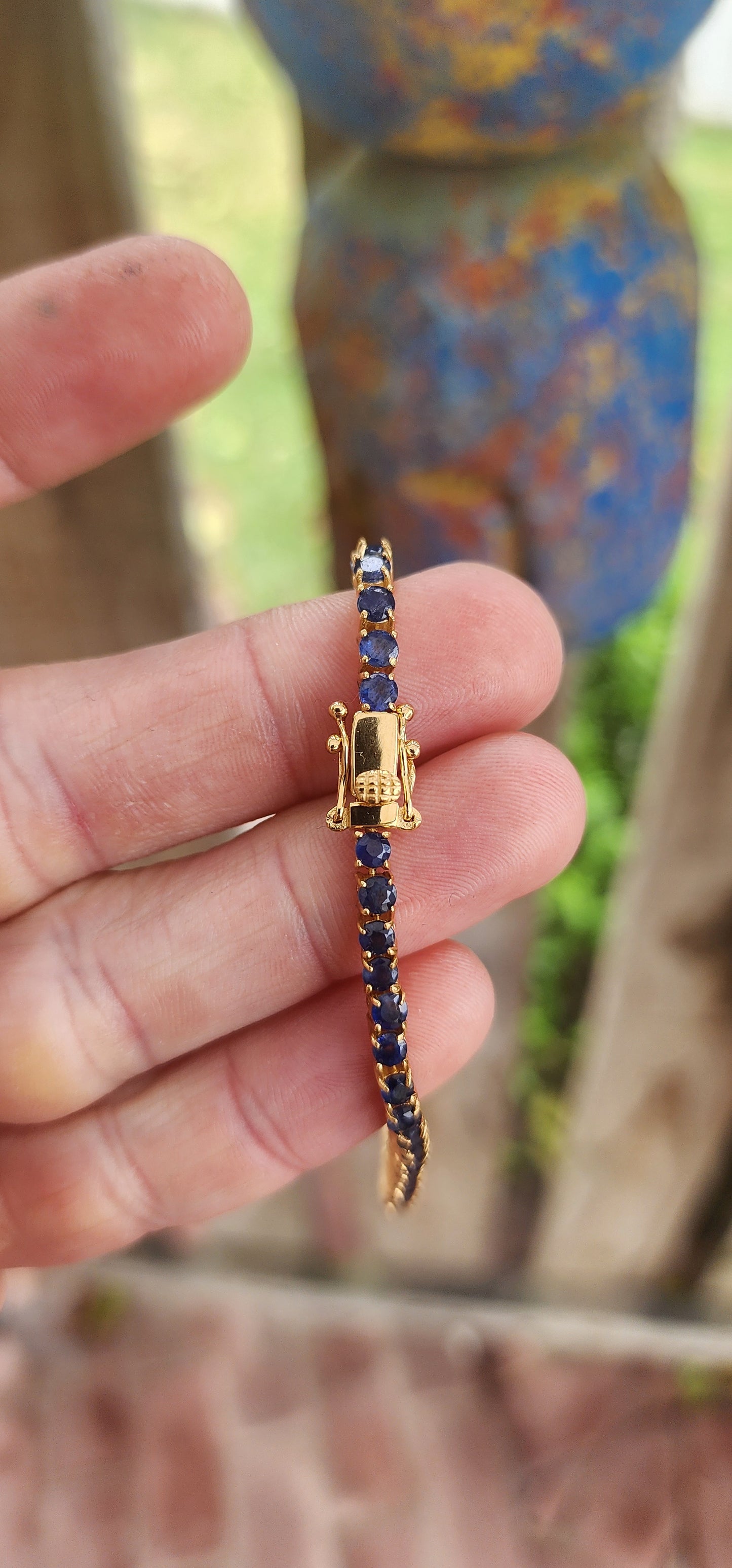 "Midnight Serenade" – A Sapphire Tennis bracelet"
Crafted in gleaming sterling silver and bathed in rich 18ct yellow gold plating.