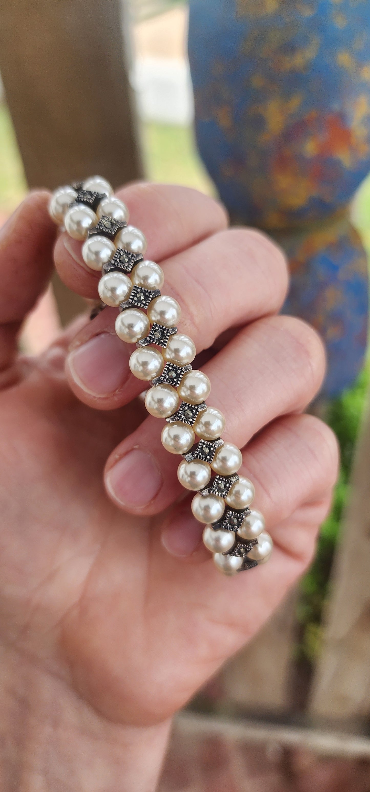 "Pearls & Petals: A Deco Daydream"This enchanting bracelet is crafted in a vintage Art Deco style — capturing the glamour of the 1920s while being a contemporary creation that channels all the charm of yesteryear.
