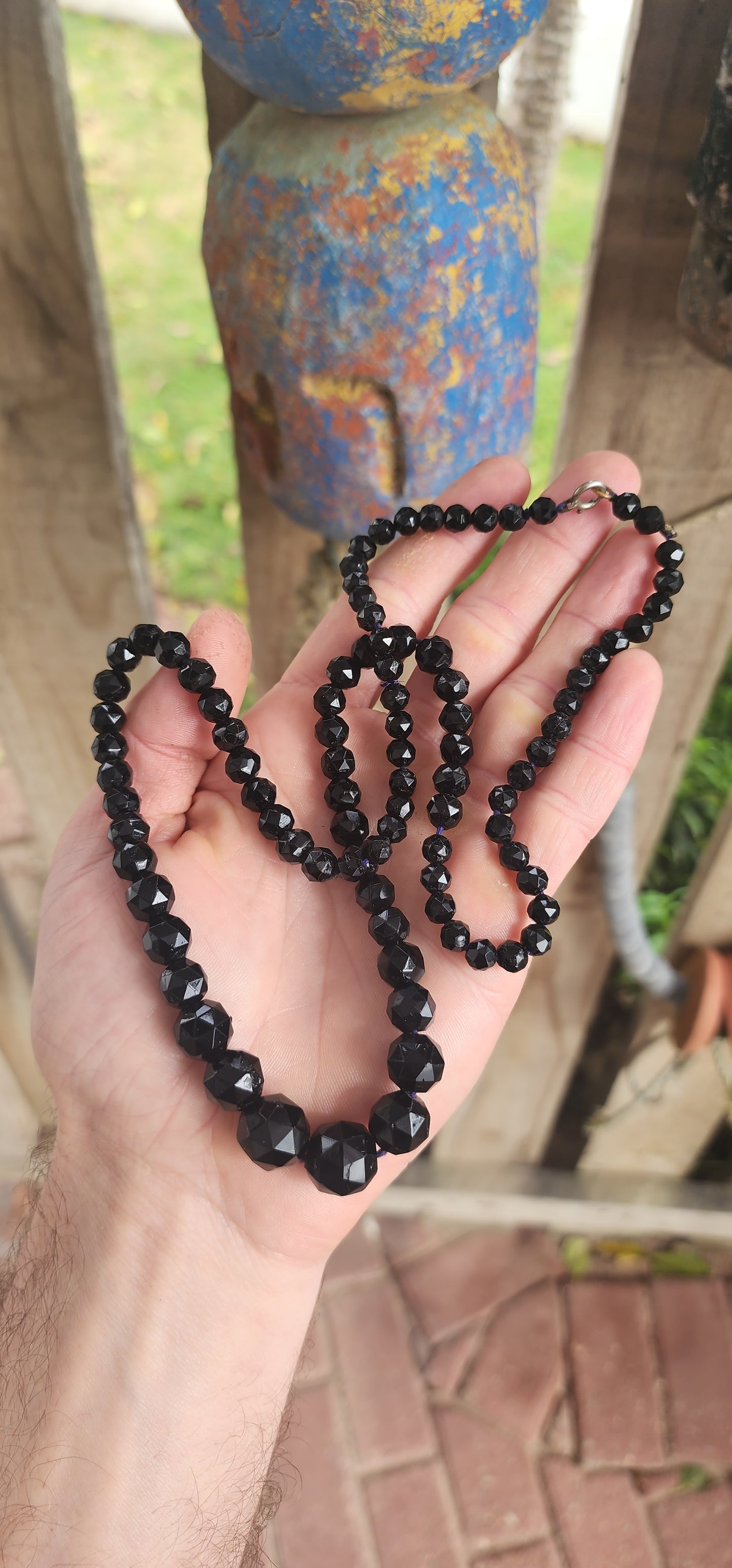 A timeless treasure from the golden age of glamour—this vintage Art Deco necklace from the 1930s features a luxurious extra length strand of glossy black French jet glass beads.