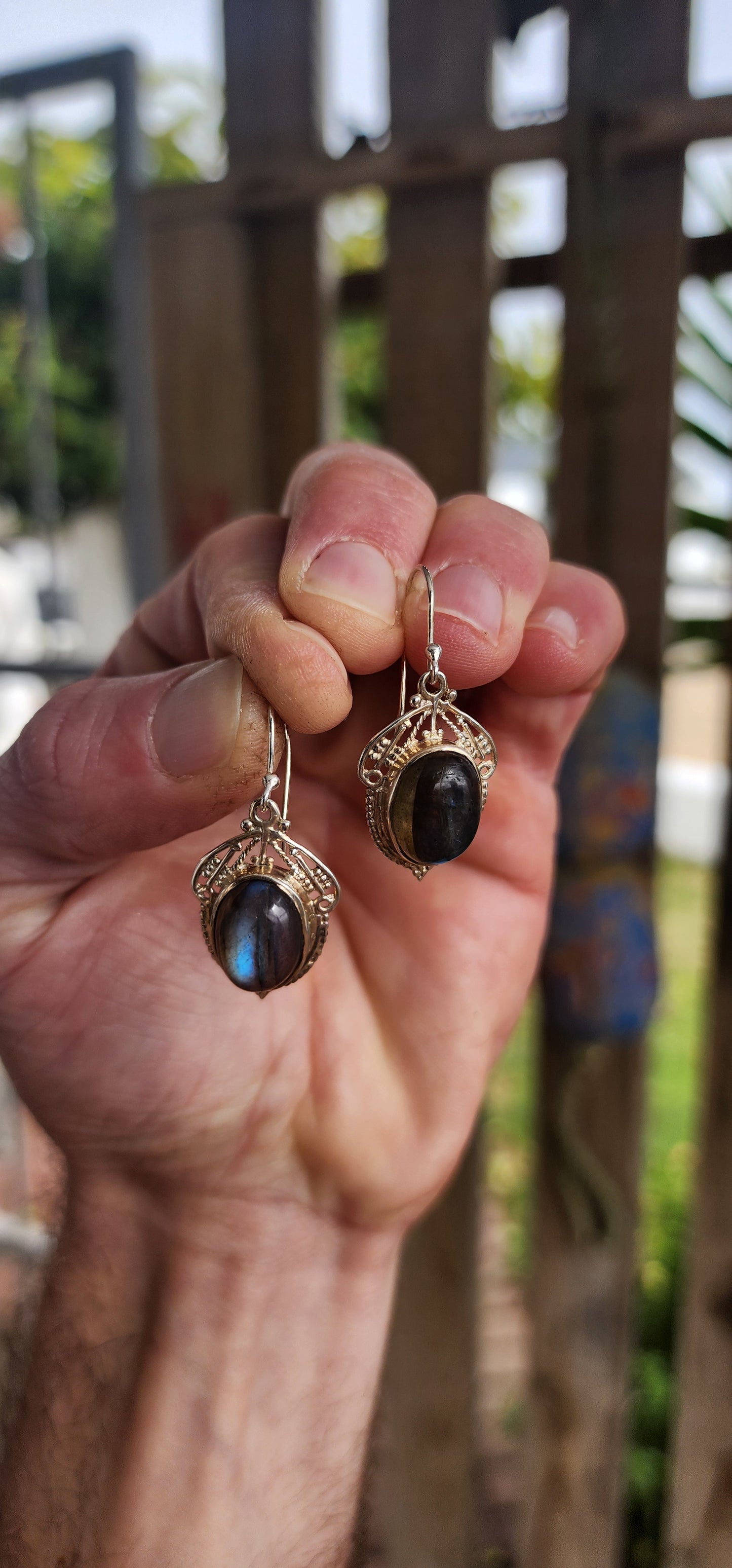 These enchanting sterling silver drop earrings are a romantic nod to the Art Nouveau era, featuring oval labradorite cabochons bezel-set atop intricate lace-like filigree backings.