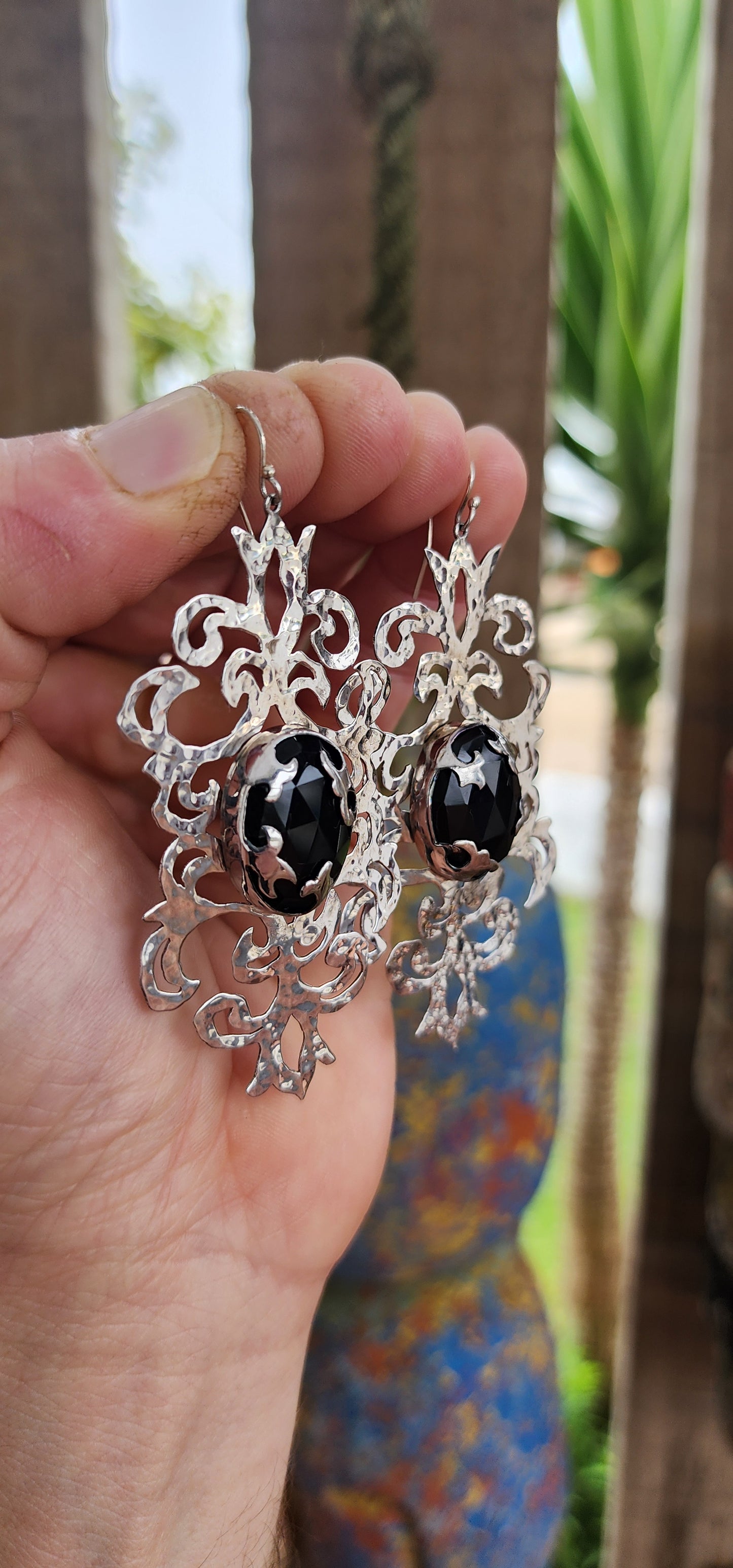 Absolutely striking and unapologetically bold — these statement earrings are a celebration of intricate craftsmanship and gothic elegance, brought to life by the acclaimed South African jewelry brand Topiary and Ashe.