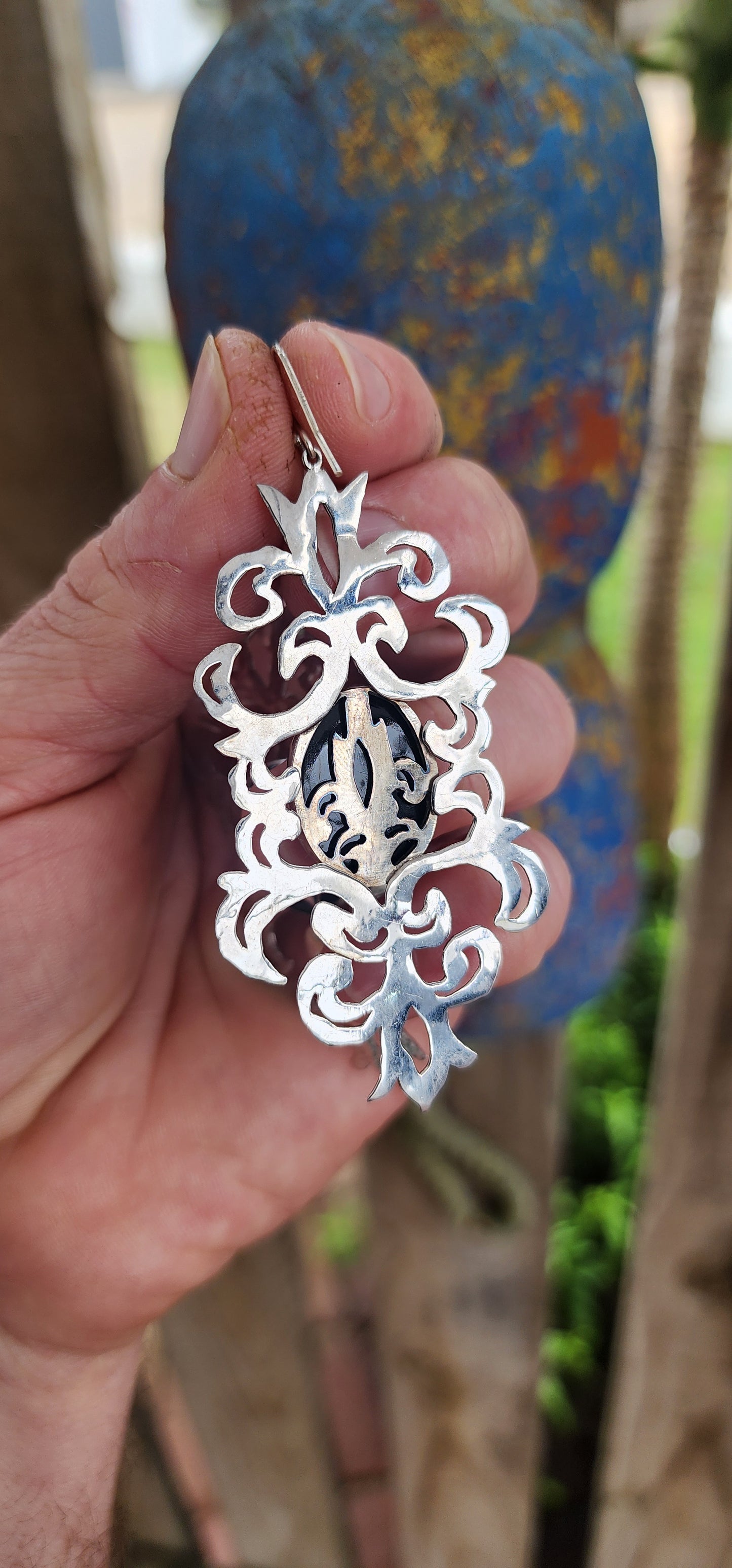 Absolutely striking and unapologetically bold — these statement earrings are a celebration of intricate craftsmanship and gothic elegance, brought to life by the acclaimed South African jewelry brand Topiary and Ashe.