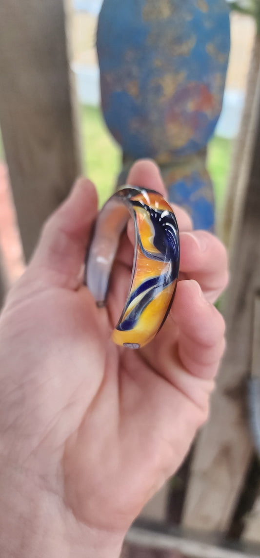 Oh, hello there, statement-maker! 
This eye-catching cuff is not your average wrist candy — it’s a wearable slice of modern art.