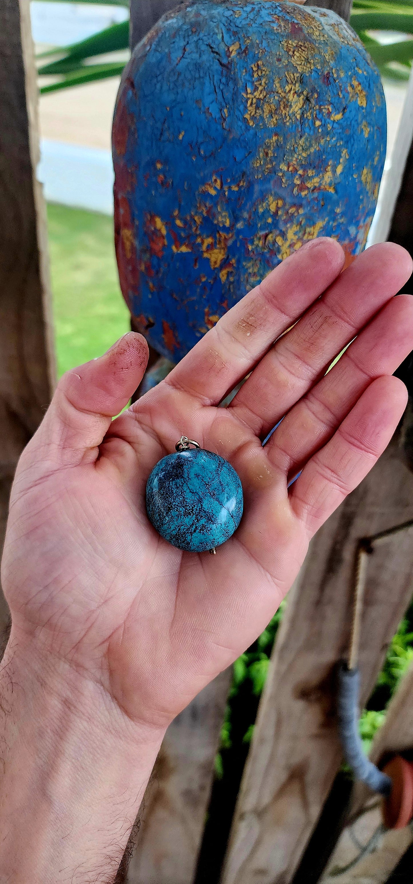 This striking pendant by Kirsten Goss features a generously sized turquoise gemstone, showcasing its signature black veining in vivid blue-green hues.