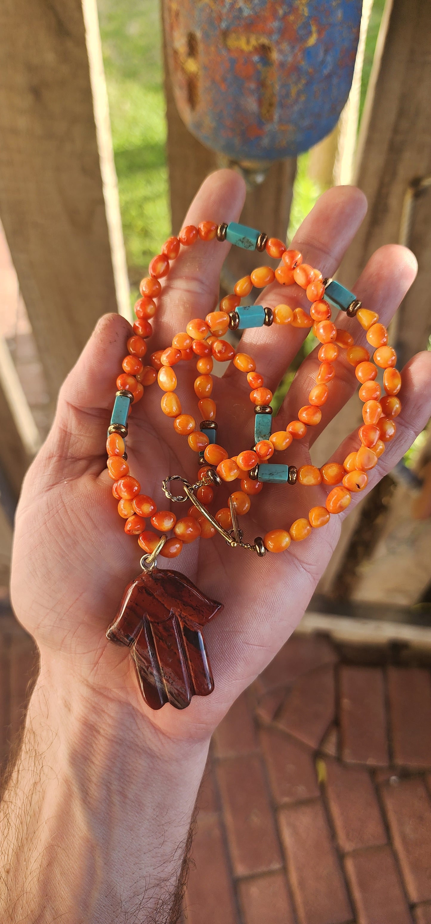 This striking, one-of-a-kind extra-length designer necklace by Beryl Dingemans beautifully fuses organic warmth with a touch of bohemian charm.