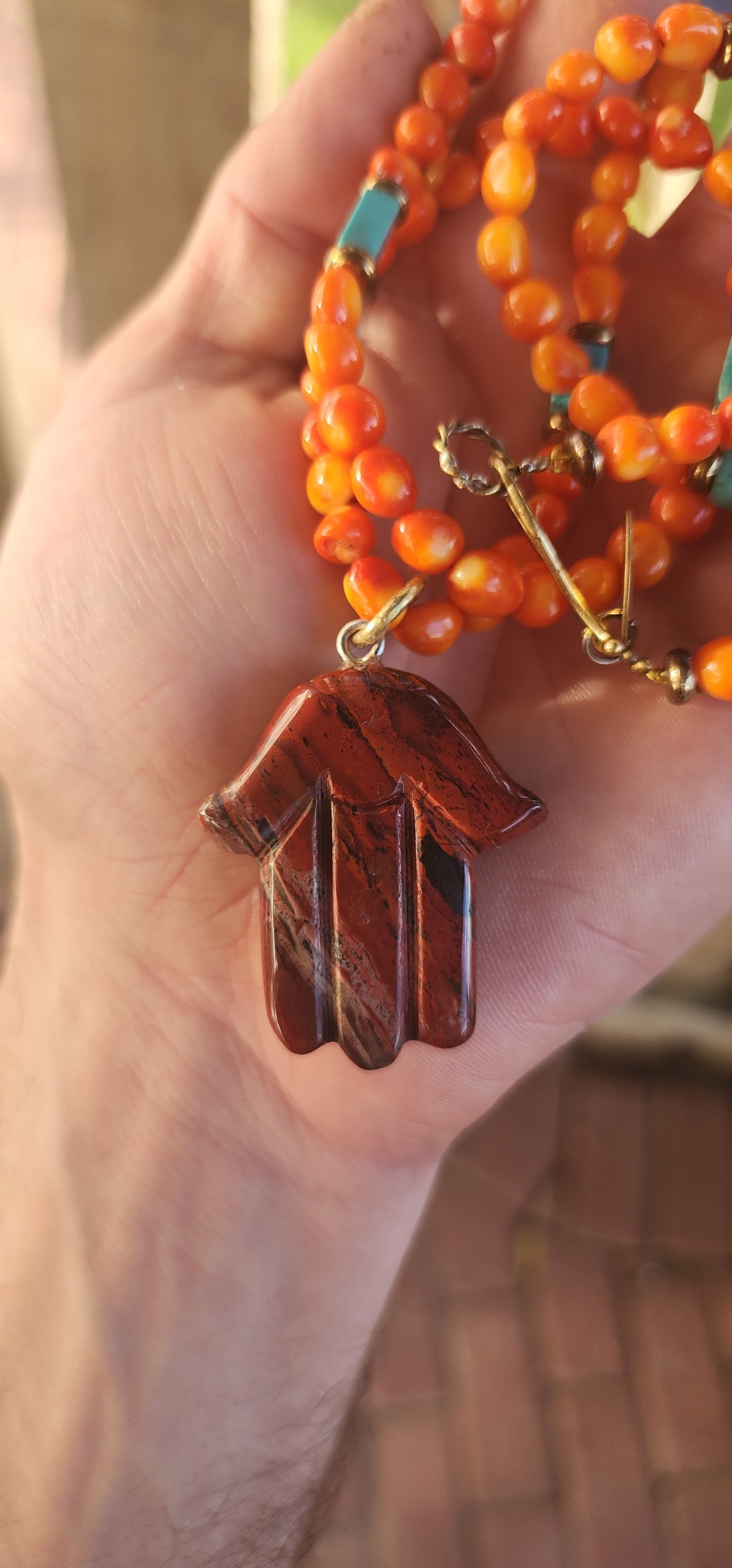 This striking, one-of-a-kind extra-length designer necklace by Beryl Dingemans beautifully fuses organic warmth with a touch of bohemian charm.
