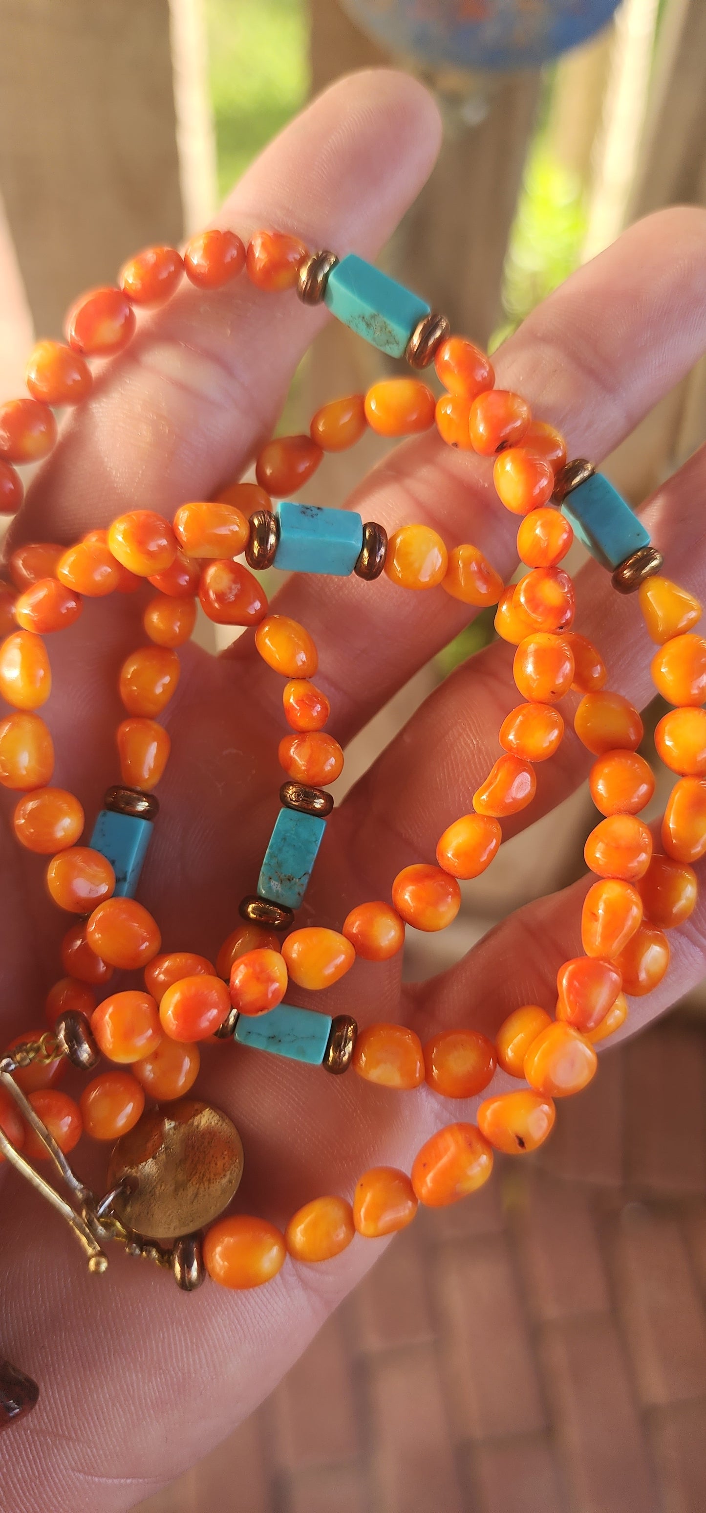 This striking, one-of-a-kind extra-length designer necklace by Beryl Dingemans beautifully fuses organic warmth with a touch of bohemian charm.