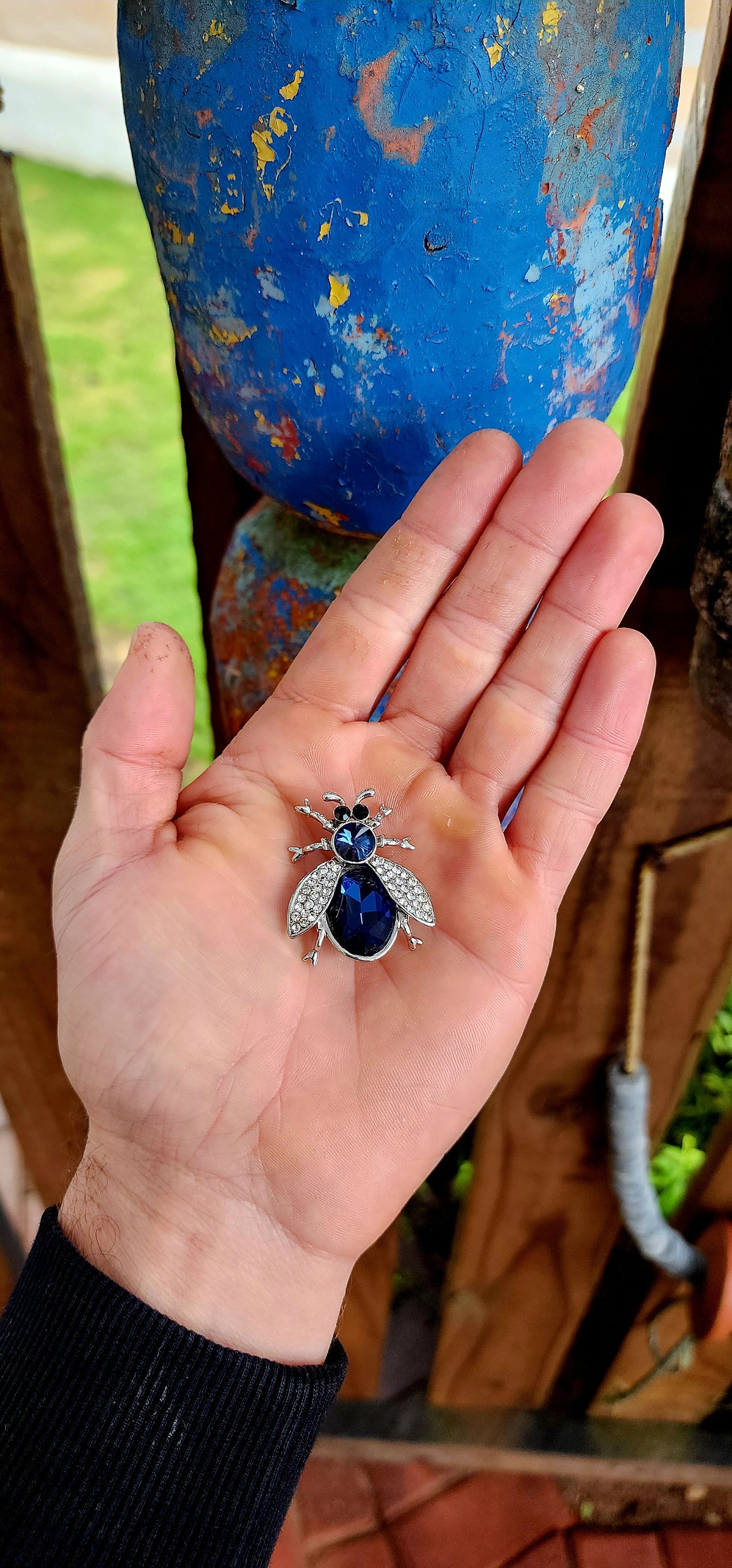Whimsical beetle-shaped costume brooch, bursting with playful elegance and a hint of vintage-inspired flair. Crafted from silvertone metal, this eye-catching piece transforms an ordinary insect motif into a sparkling delight.
