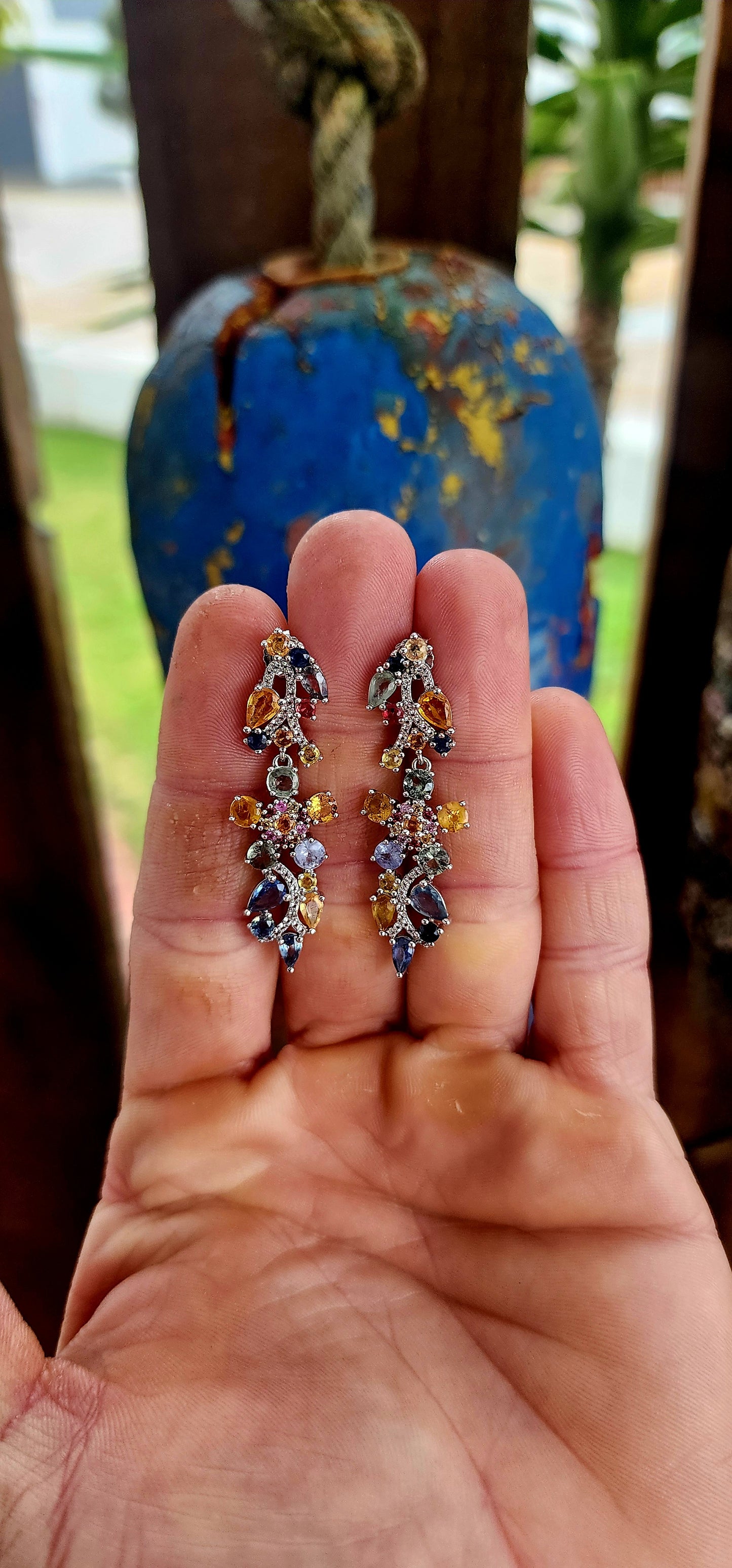 Behold these utterly enchanting drop earrings — a vibrant ode to nature’s poetry, woven in precious gemstones.
