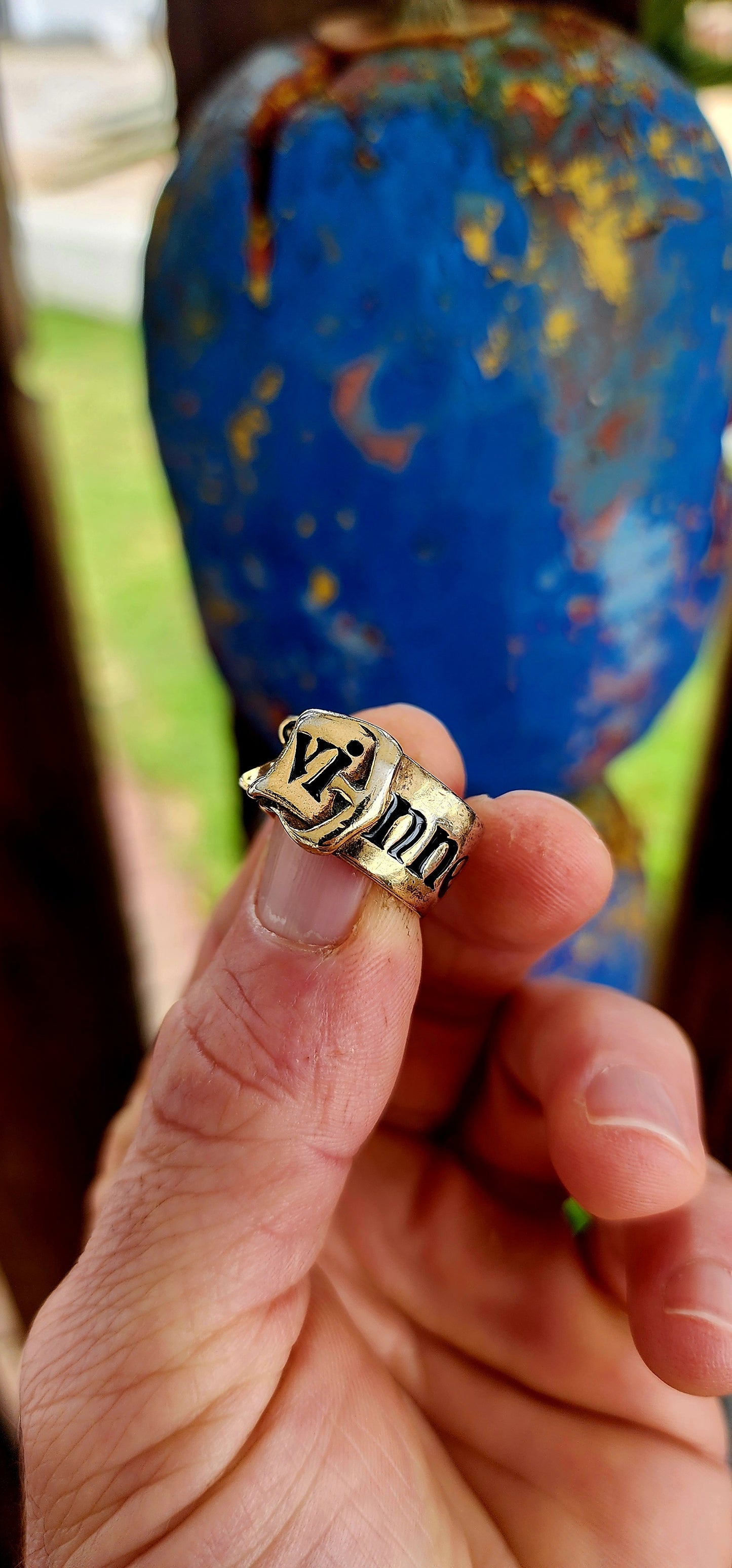 This striking designer ring is a creation of the legendary Vivienne Westwood, crafted in sterling silver with a lavish layer of gold plating. Evoking one of Westwood’s most beloved house codes, the ring takes the form of a sculpted belt with a buckle.