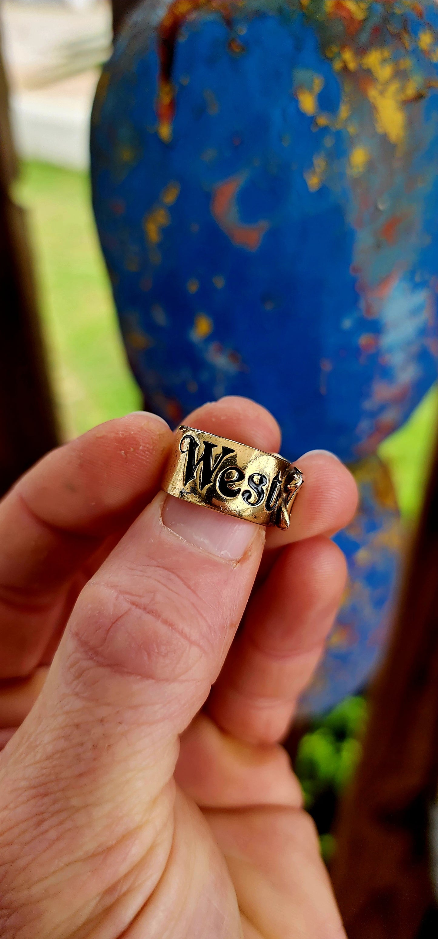 This striking designer ring is a creation of the legendary Vivienne Westwood, crafted in sterling silver with a lavish layer of gold plating. Evoking one of Westwood’s most beloved house codes, the ring takes the form of a sculpted belt with a buckle.