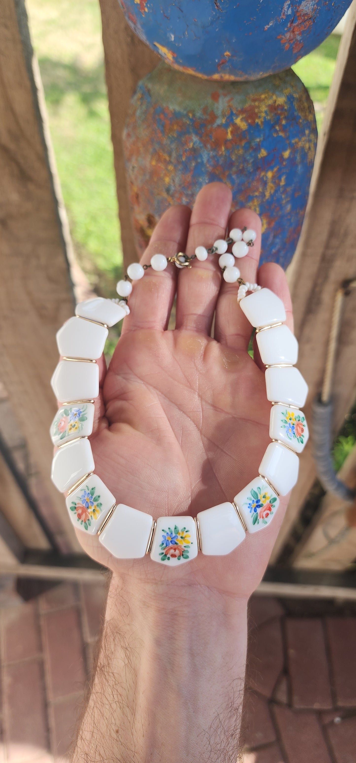 Vintage 1950s German Milk Glass Floral Panel Choker Necklace.
Crafted in West Germany during the 1950s, it showcases the highly prized milk glass — a luscious, opaque white glass popular from the Victorian era well into the mid-20th century.