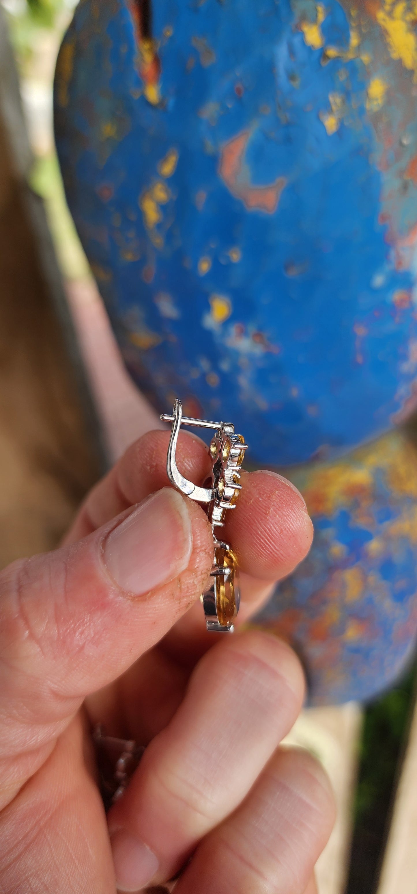 These elegant sterling silver drop earrings are a luminous tribute to nature’s golden glow, with a design inspired by delicate orchid blossoms.