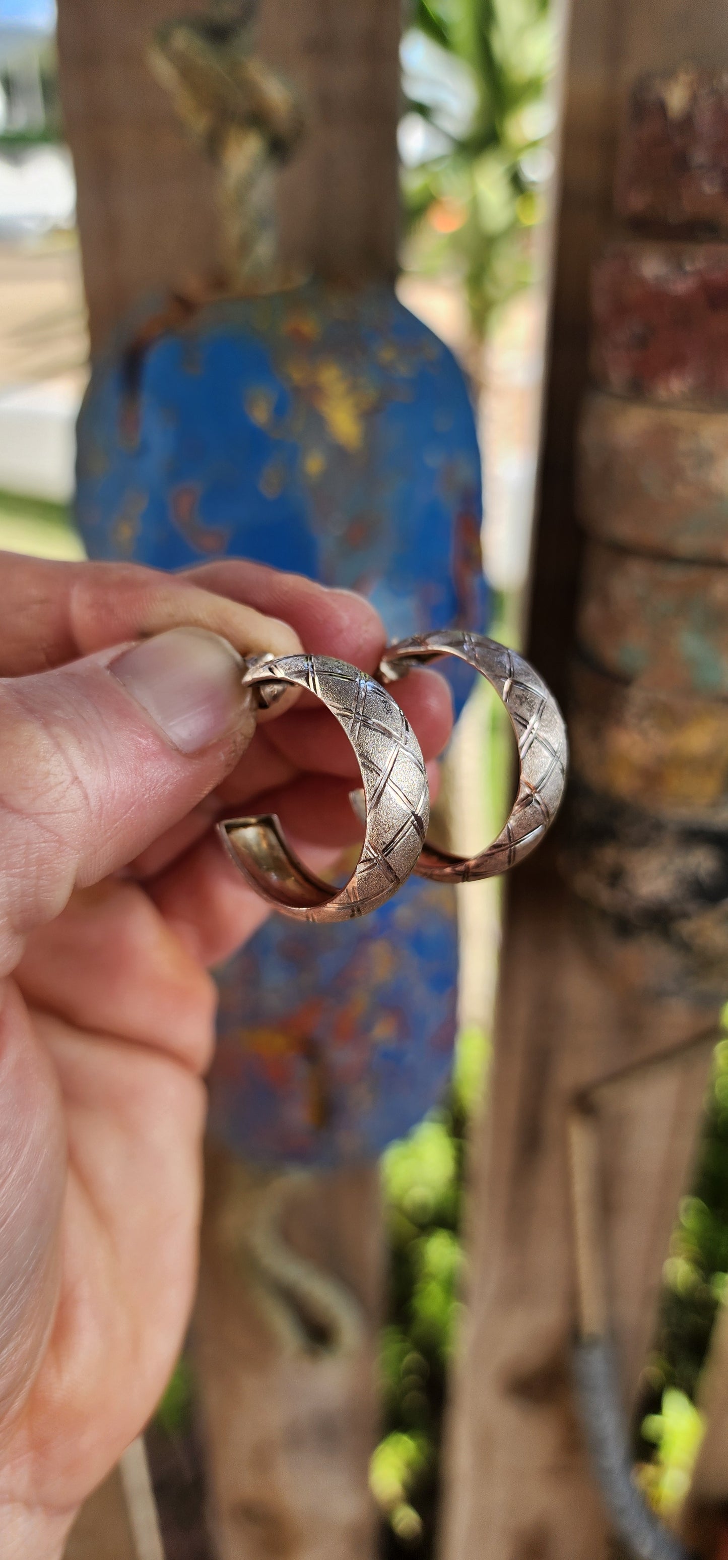 These striking vintage sterling silver half hoop earrings blend sculptural form with textured artistry for a look that’s equal parts bold and wearable.