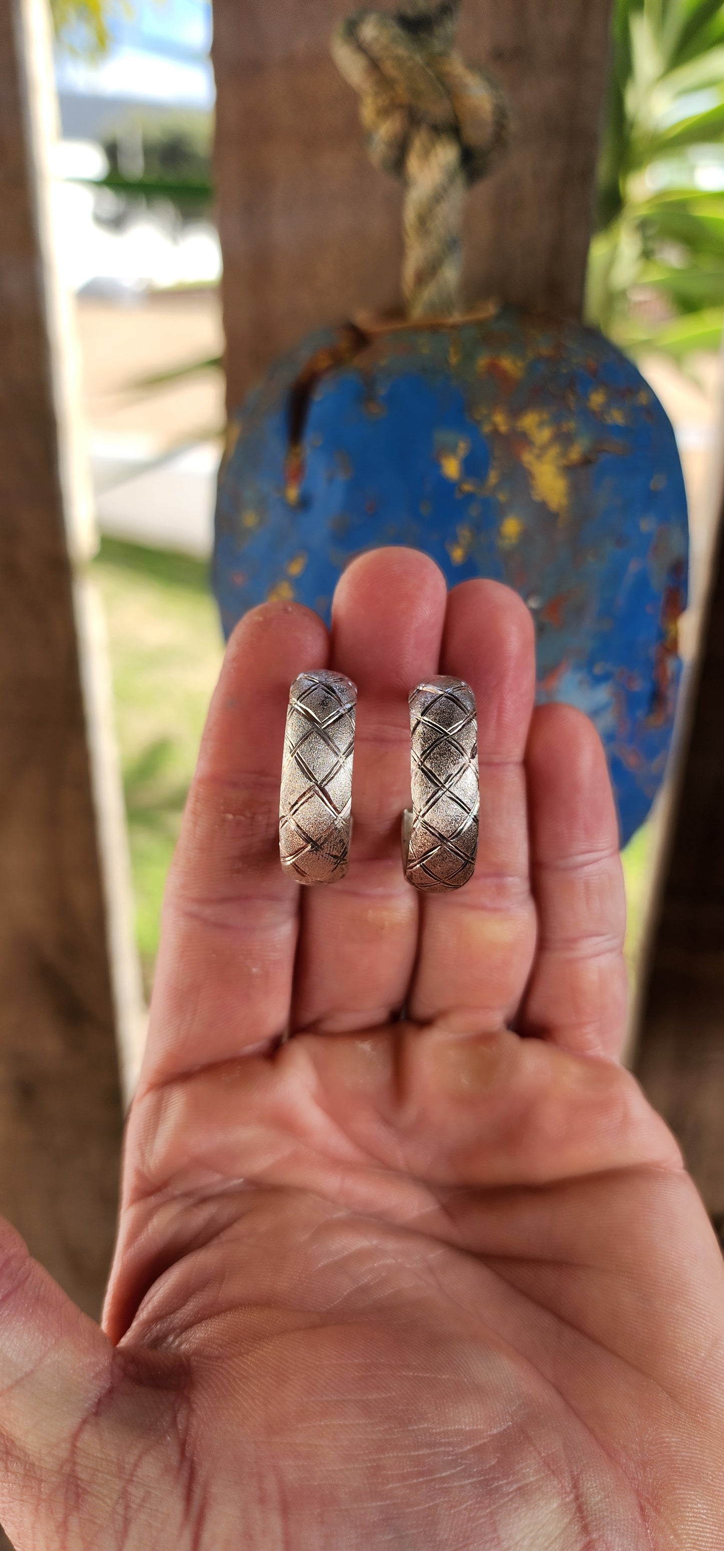 These striking vintage sterling silver half hoop earrings blend sculptural form with textured artistry for a look that’s equal parts bold and wearable.