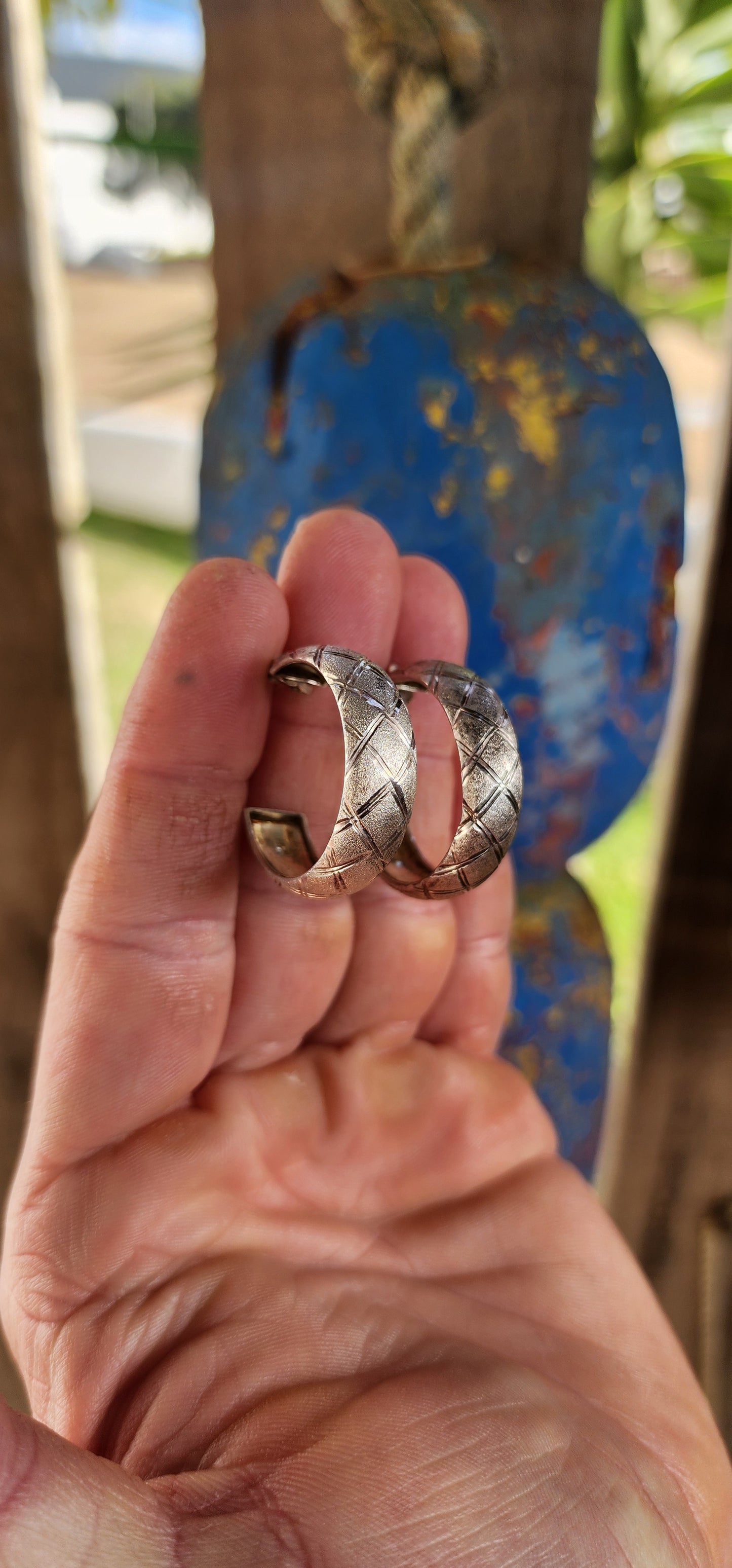 These striking vintage sterling silver half hoop earrings blend sculptural form with textured artistry for a look that’s equal parts bold and wearable.