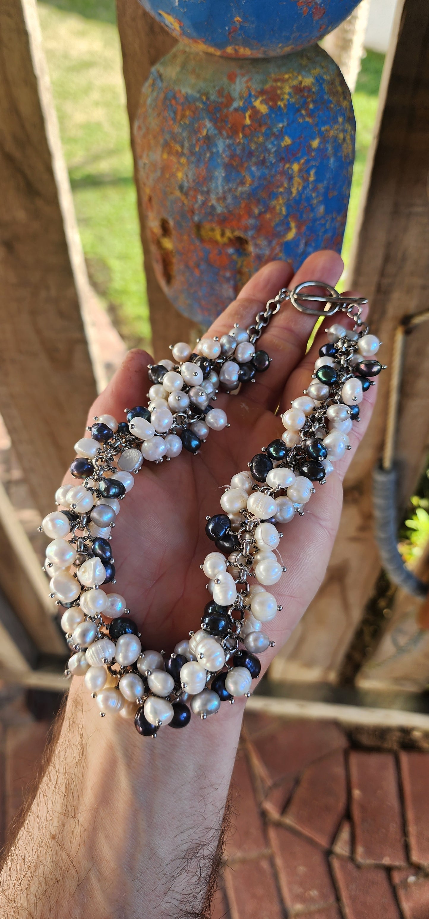 A bold twist on classic elegance — this magnificent statement necklace bursts with organic charm and lush texture!