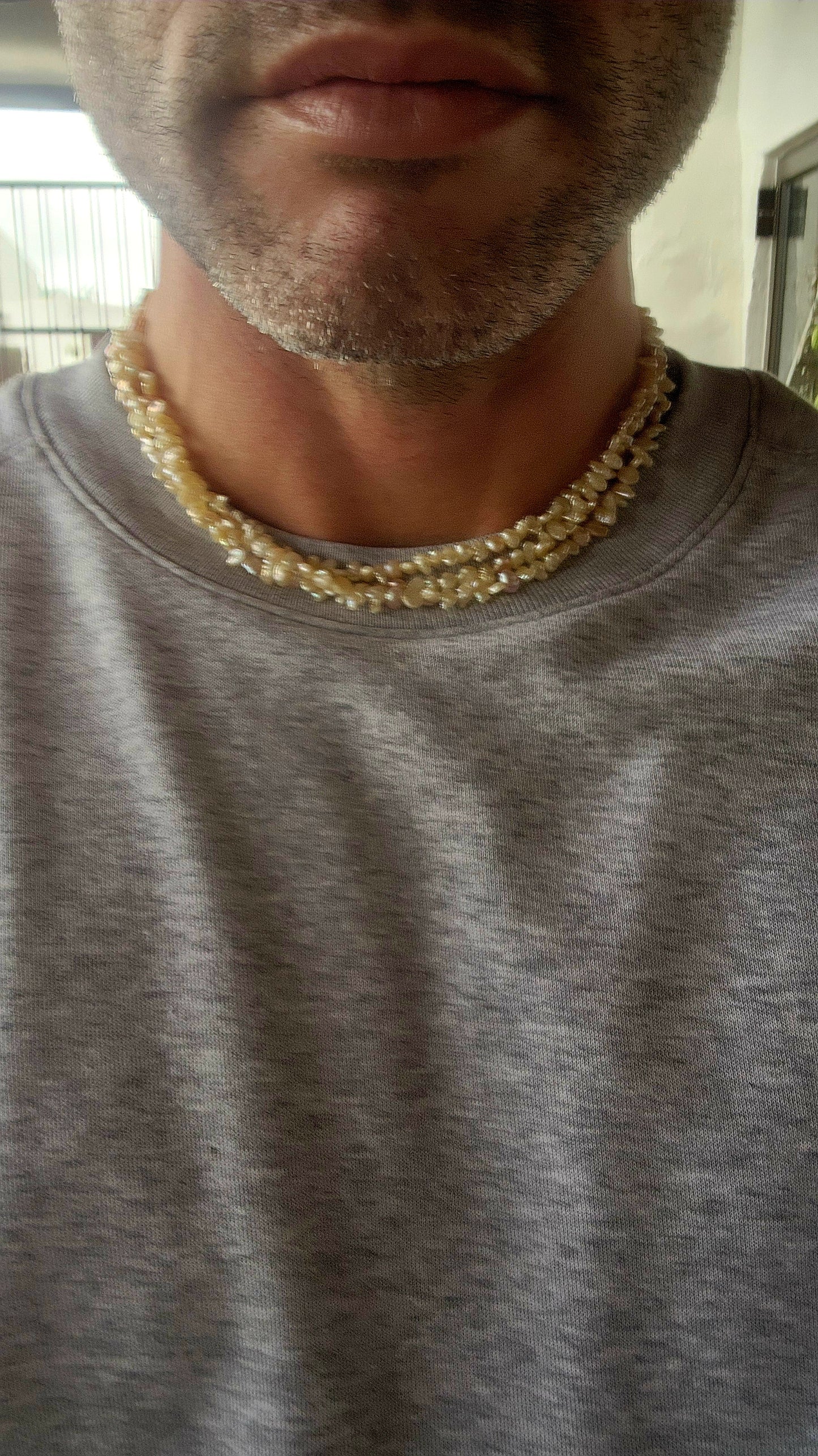 This beautiful vintage art deco era necklace showcases three strands of luminous freshwater keshi rice pearls, each with its own unique, organic shape.