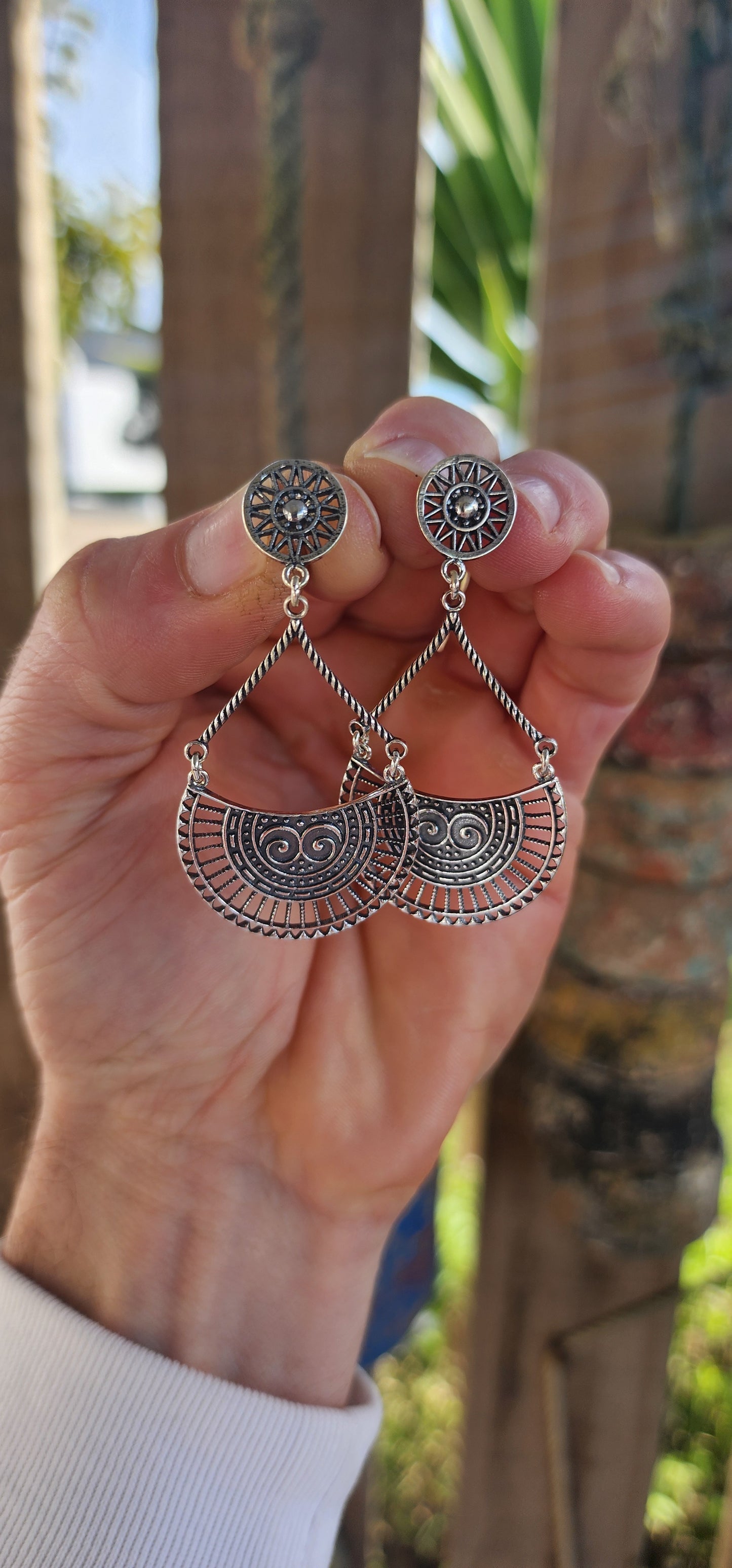 These striking earrings are crafted in solid sterling silver, showcasing a bold bohemian–tribal aesthetic that’s both artistic and wearable.