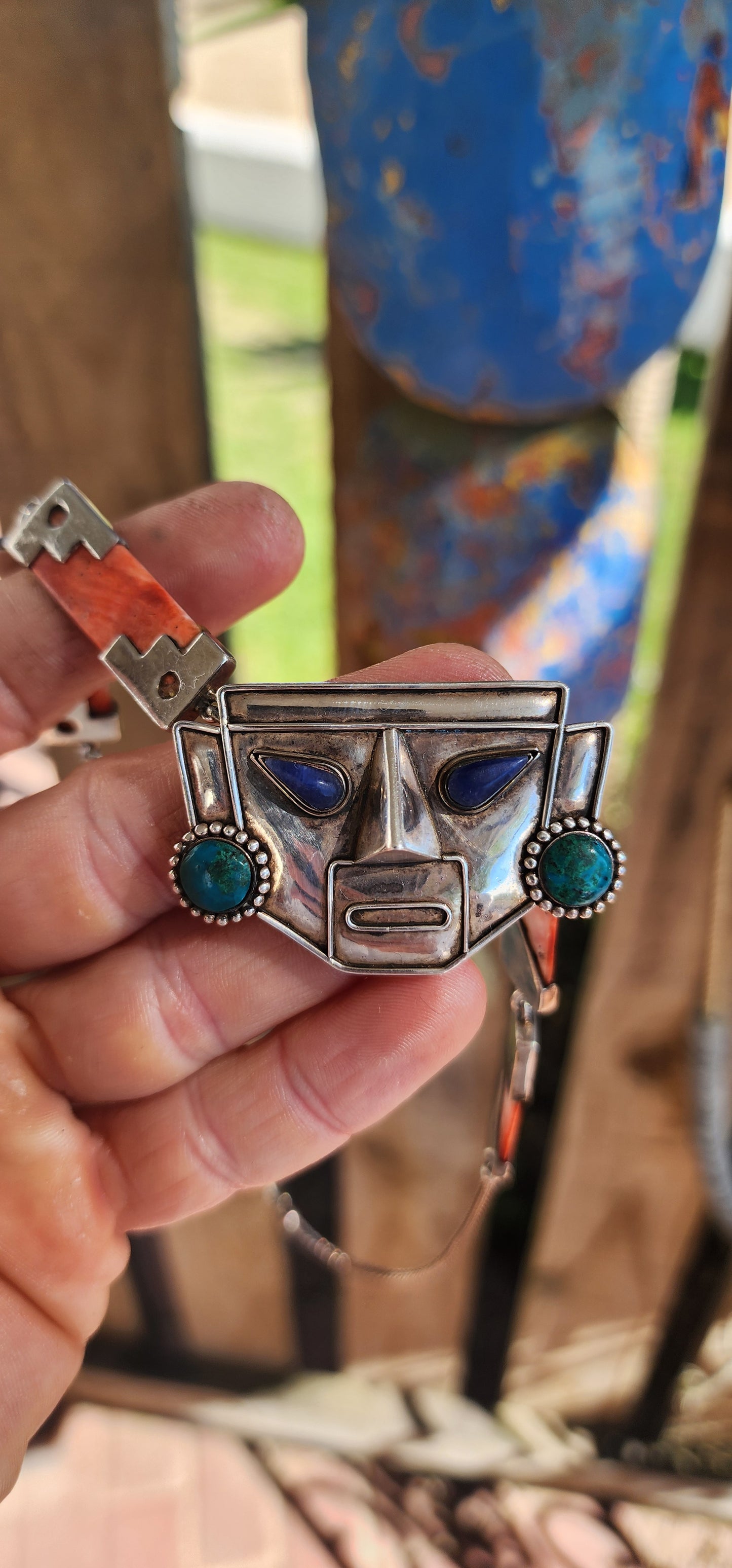 This striking vintage necklace is a true celebration of Andean artistry and cultural symbolism. Crafted in sterling silver, it features a bold central pendant in the form of an Incan-inspired mask.
