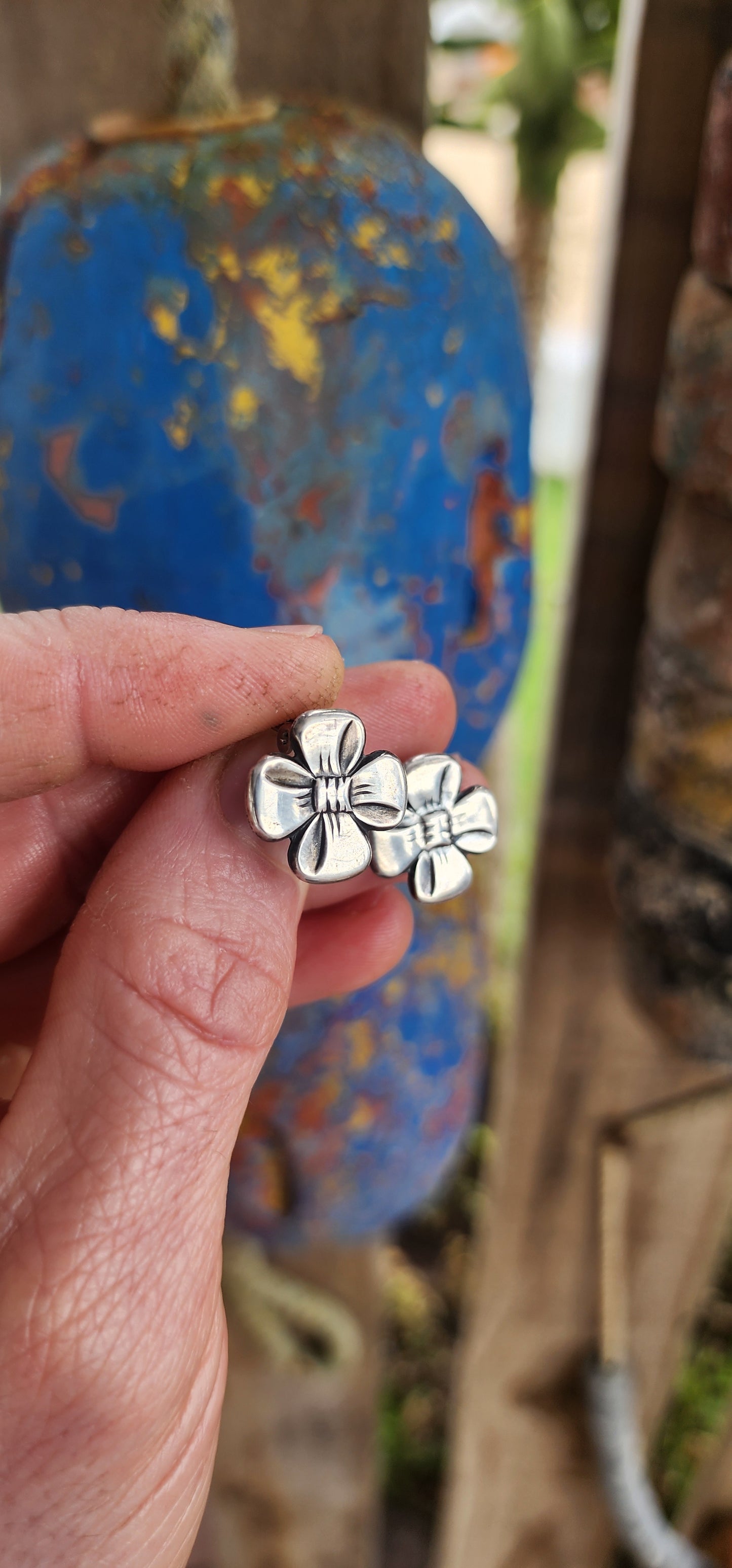 This vintage pair of clip-on earrings, crafted circa 1957, is a charming showcase of Scandinavian design elegance.