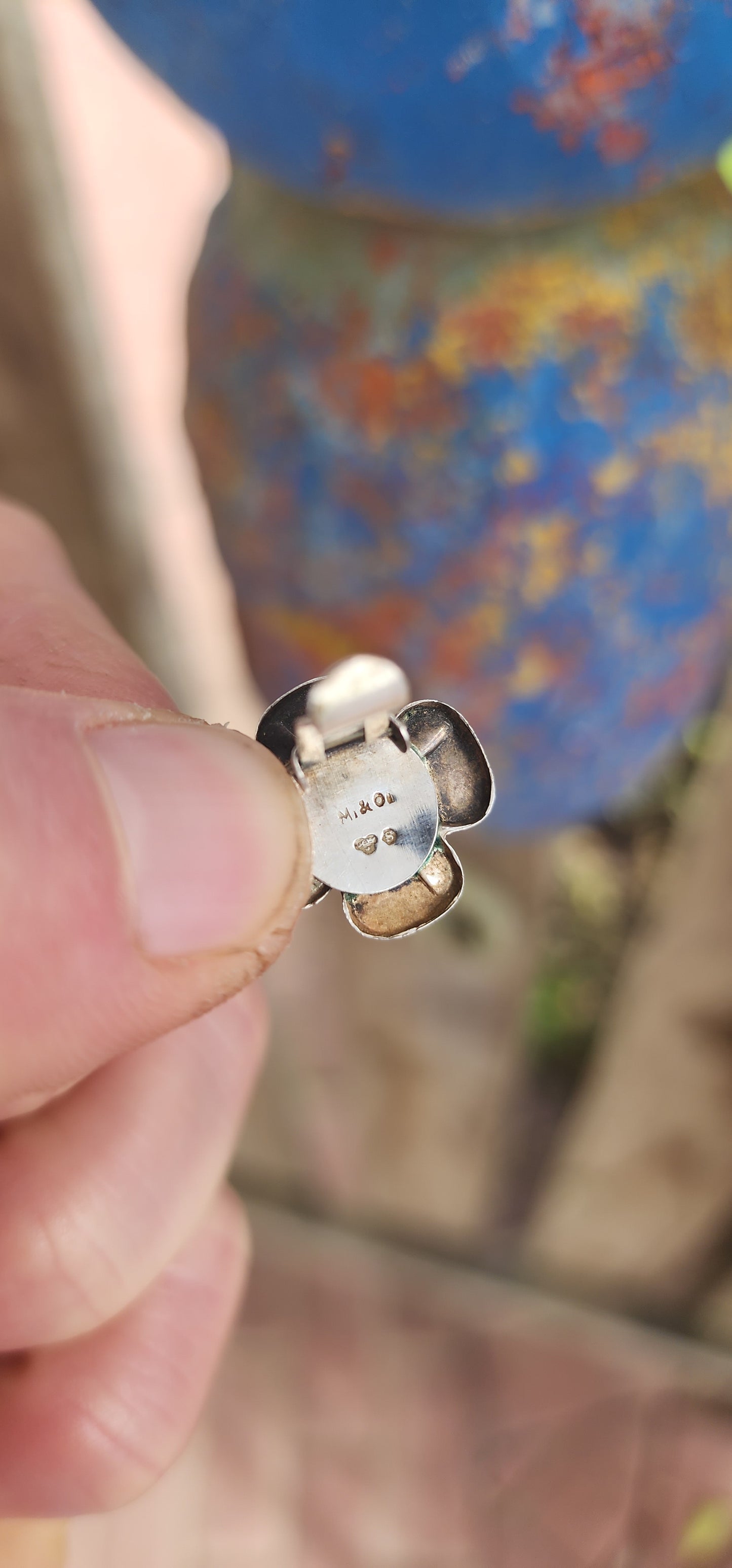 This vintage pair of clip-on earrings, crafted circa 1957, is a charming showcase of Scandinavian design elegance.