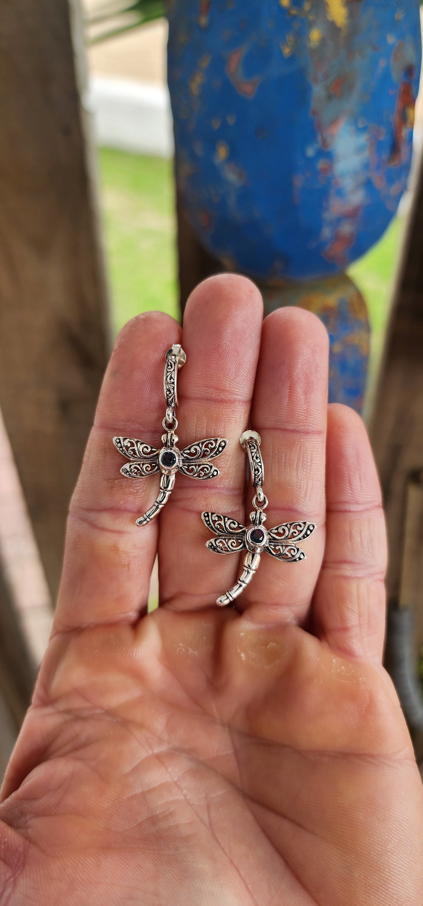 Gracefully suspended in sterling silver, these captivating dragonfly push-in earrings are more than mere adornments — they are talismans of transformation and light.