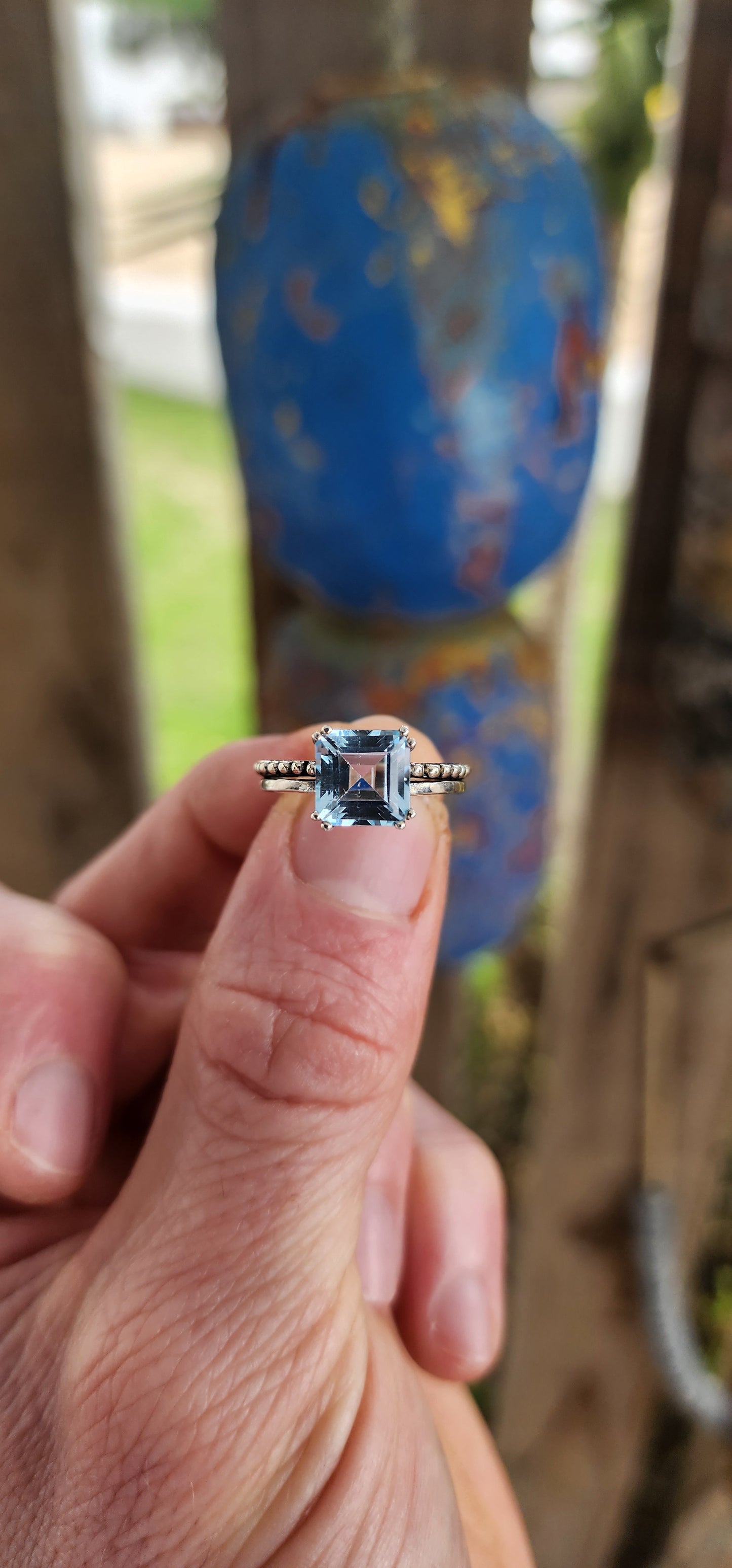 This elegant ring is crafted in polished sterling silver, showcasing a striking solitaire sky blue topaz as its centerpiece.