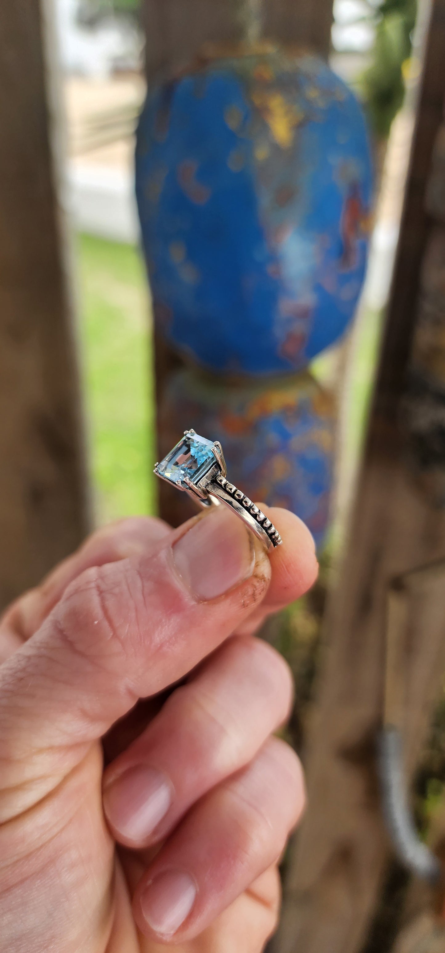 This elegant ring is crafted in polished sterling silver, showcasing a striking solitaire sky blue topaz as its centerpiece.