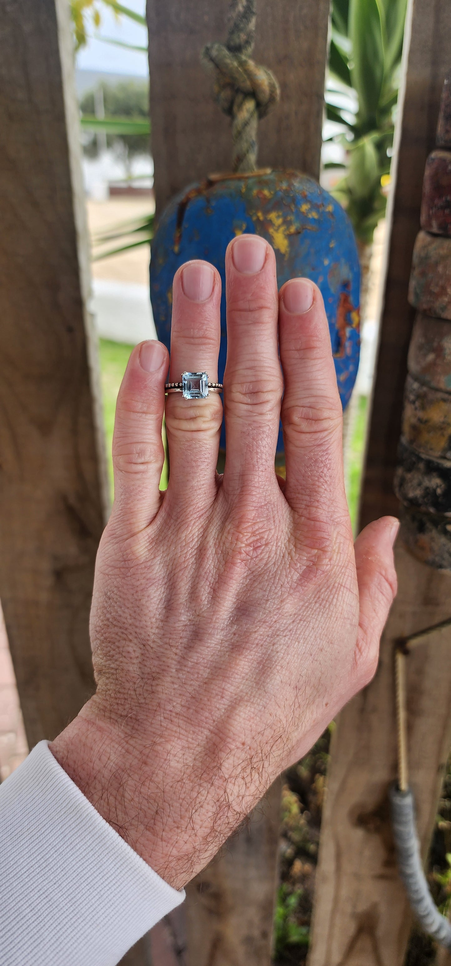 This elegant ring is crafted in polished sterling silver, showcasing a striking solitaire sky blue topaz as its centerpiece.