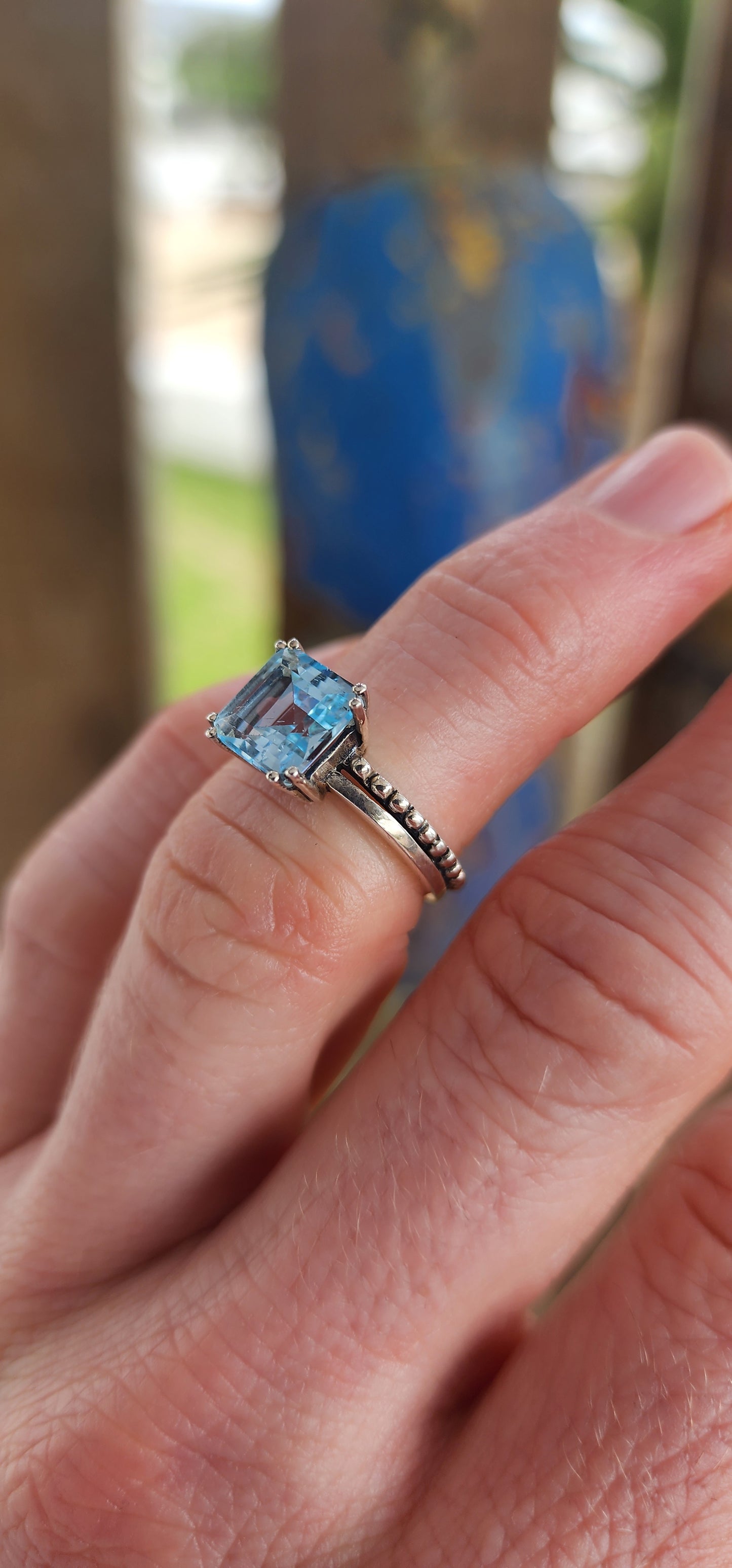 This elegant ring is crafted in polished sterling silver, showcasing a striking solitaire sky blue topaz as its centerpiece.