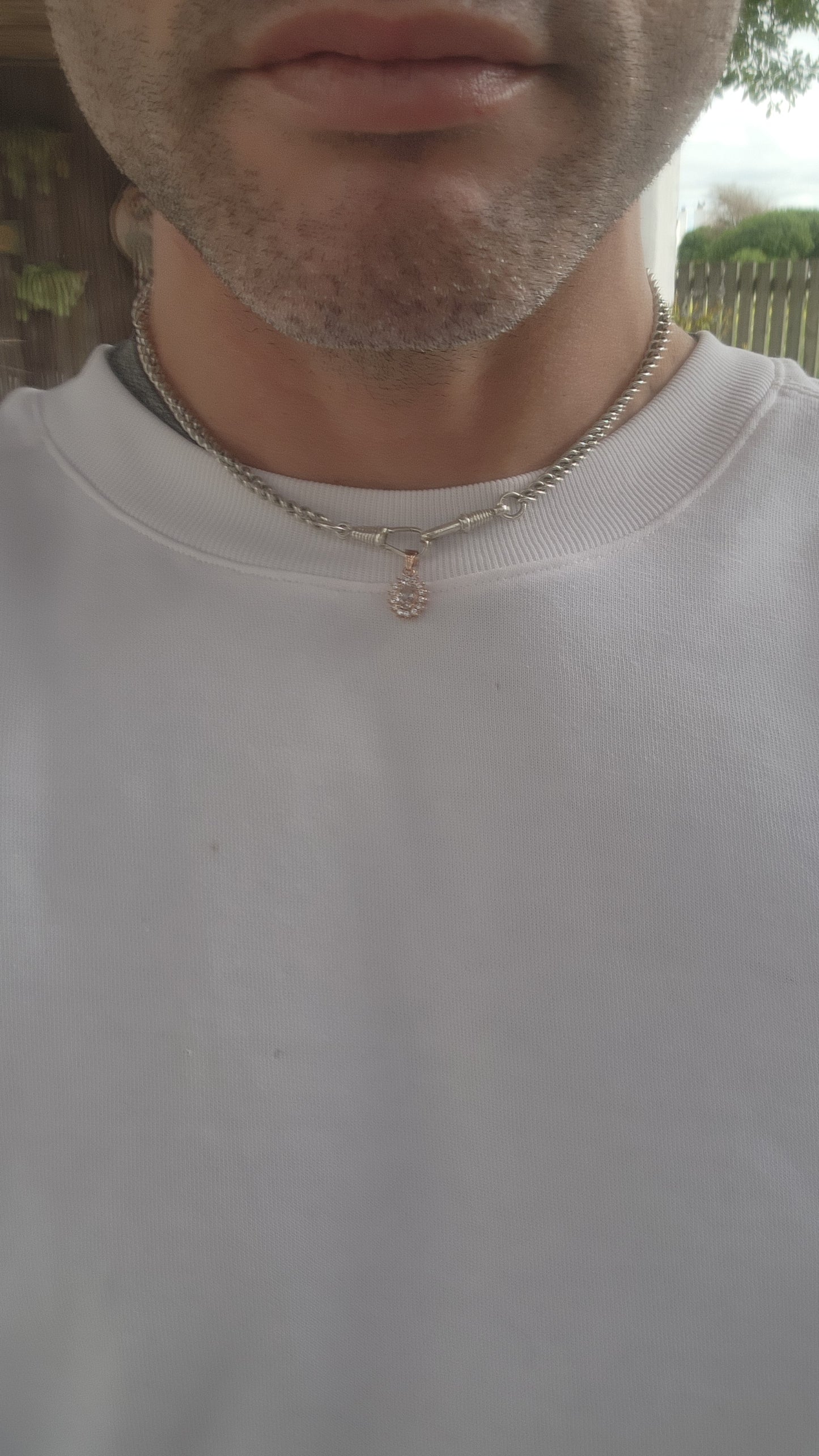 This enchanting pendant is crafted in warm rose gold-plated sterling silver, designed in a refined oval halo style. At its heart rests a soft blush-pink oval-cut morganite, glowing with gentle feminine radiance.