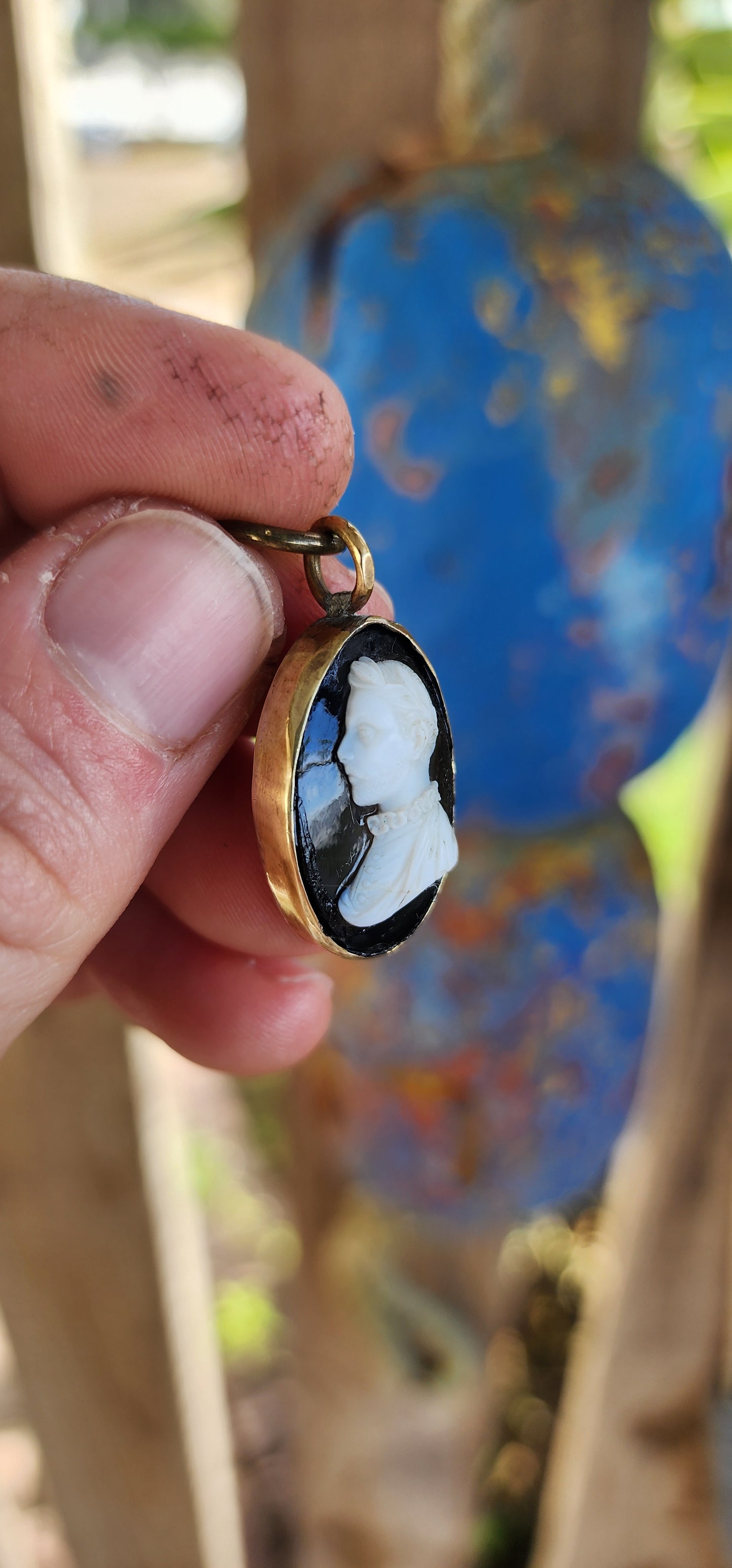 This is an antique Victorian-era cameo pendant, dating from the mid-to-late 19th century, crafted in the popular Neoclassical Revival style that dominated jewelry of the time.