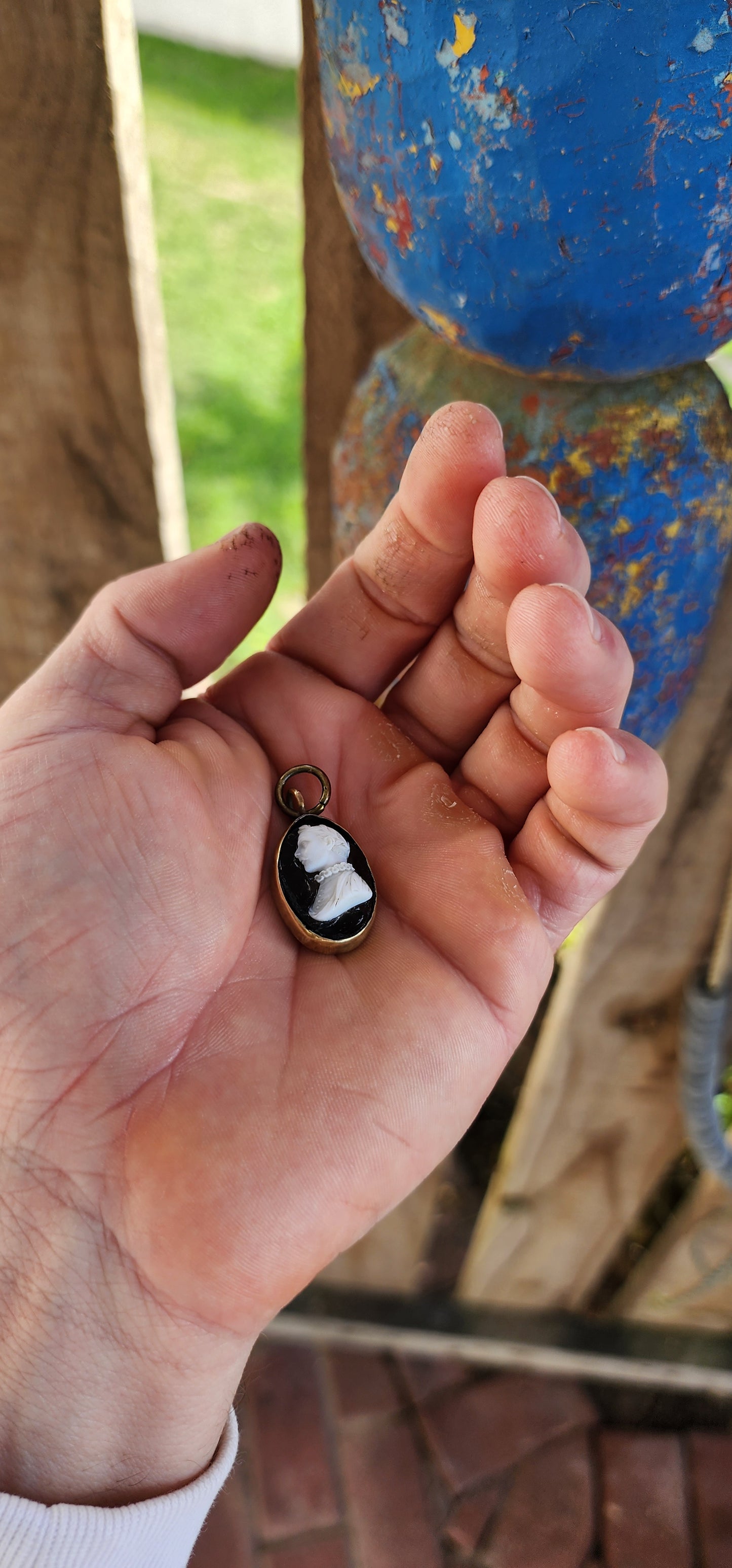 This is an antique Victorian-era cameo pendant, dating from the mid-to-late 19th century, crafted in the popular Neoclassical Revival style that dominated jewelry of the time.