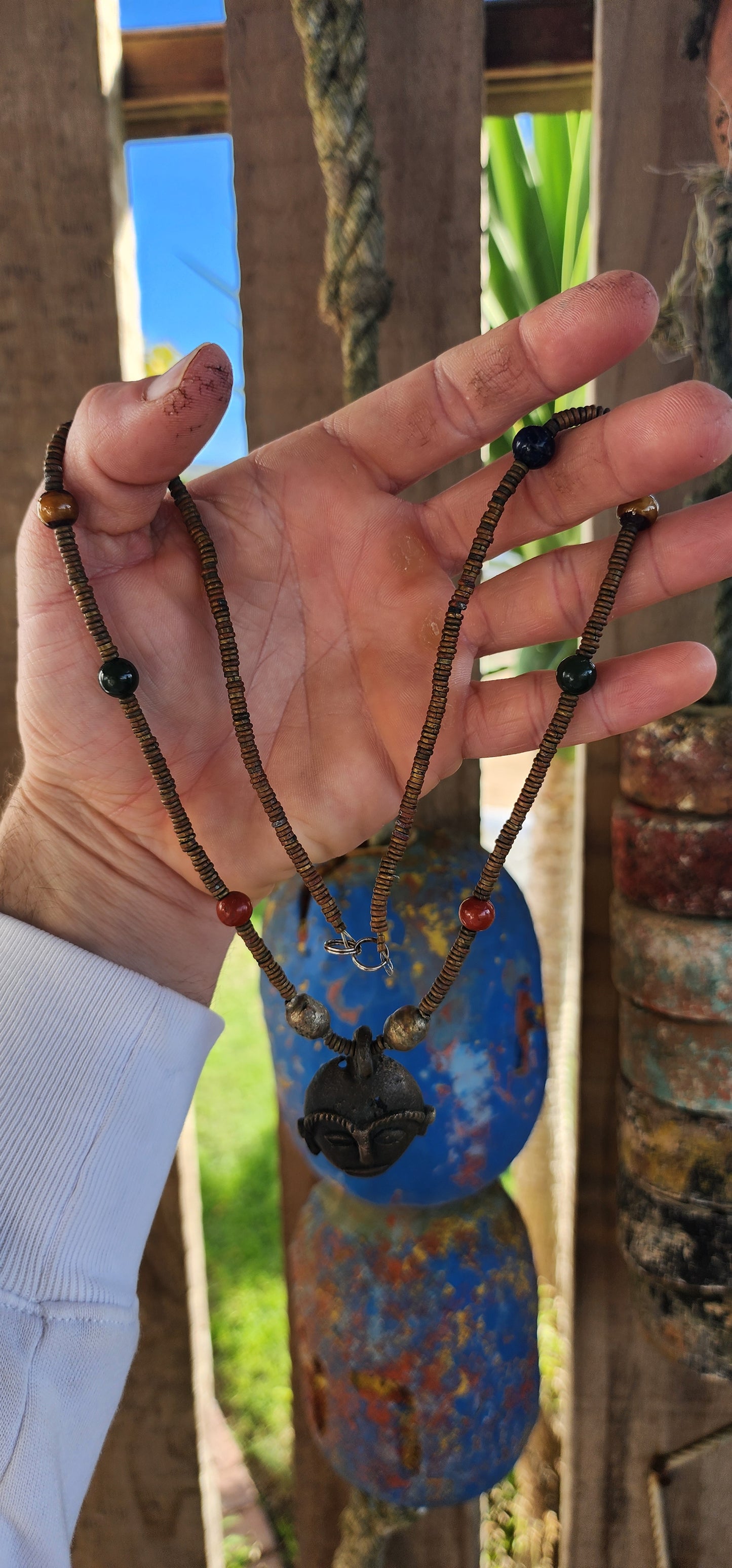 This striking vintage ethnic statement necklace hails from Ghana West Africa, where jewelry and adornment are deeply tied to cultural identity and symbolism.