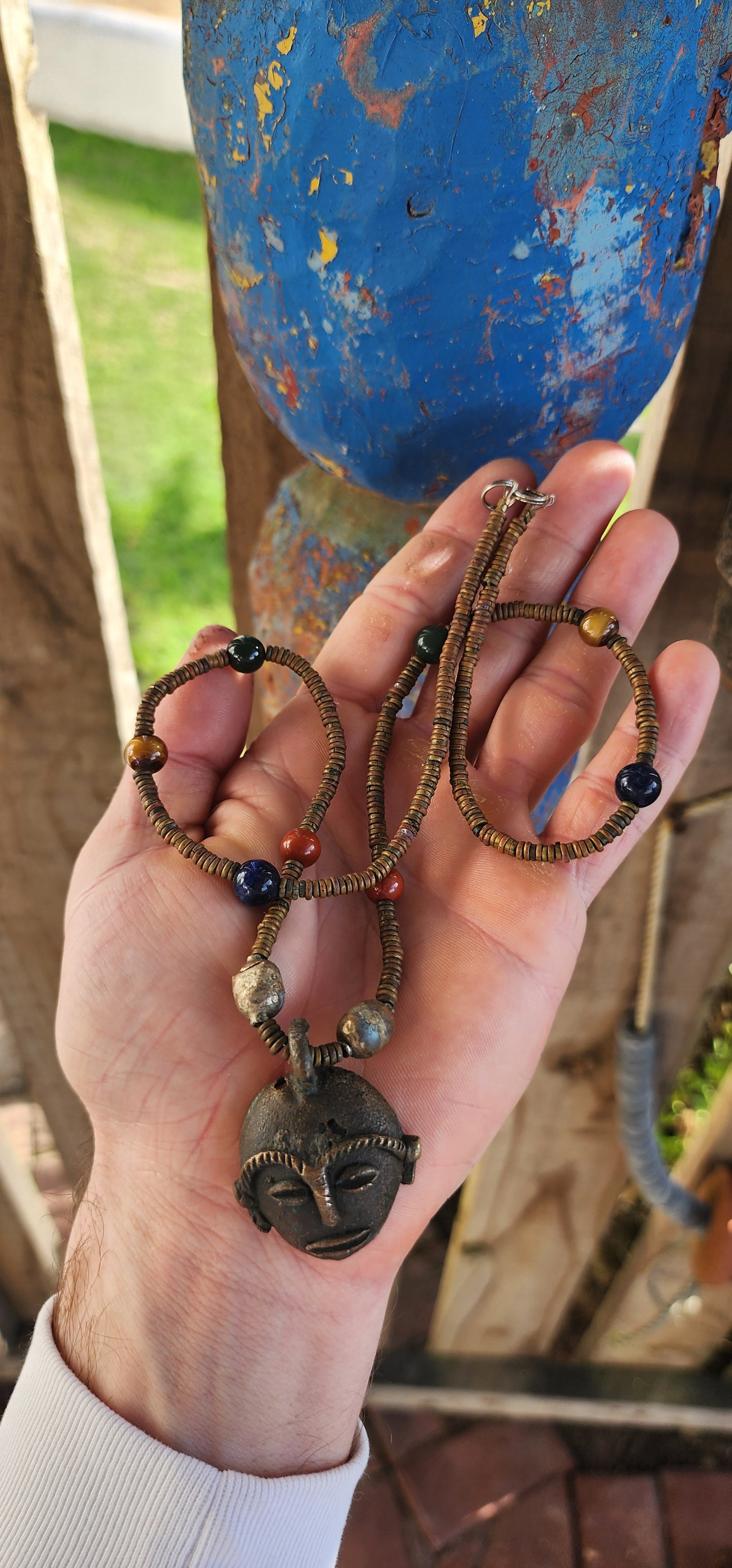 This striking vintage ethnic statement necklace hails from Ghana West Africa, where jewelry and adornment are deeply tied to cultural identity and symbolism.