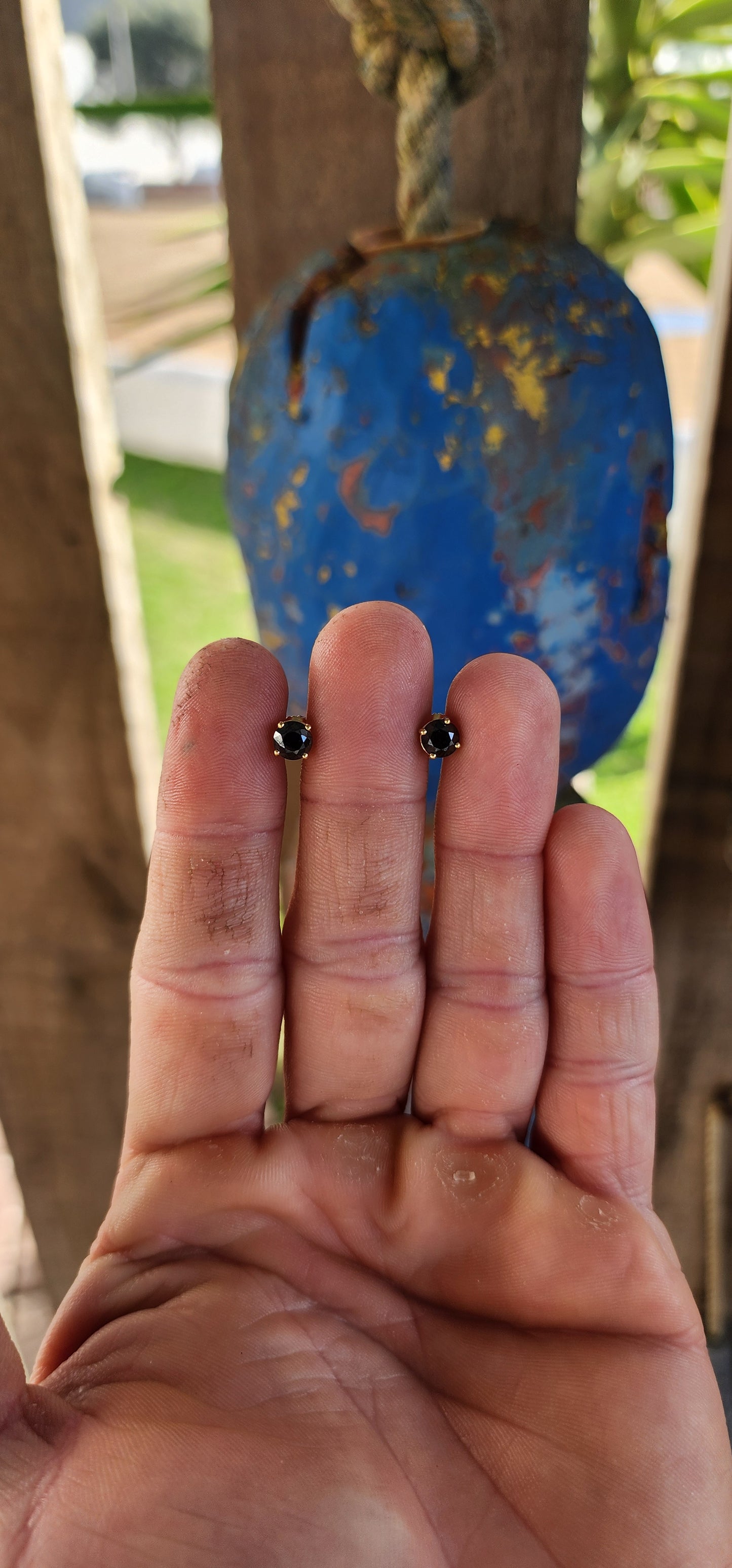 These classical stud earrings, crafted in rich 9ct yellow gold, embody understated sophistication. Each earring showcases a brilliant round-cut black diamond, its mysterious depth echoing the velvet darkness of a starless night.