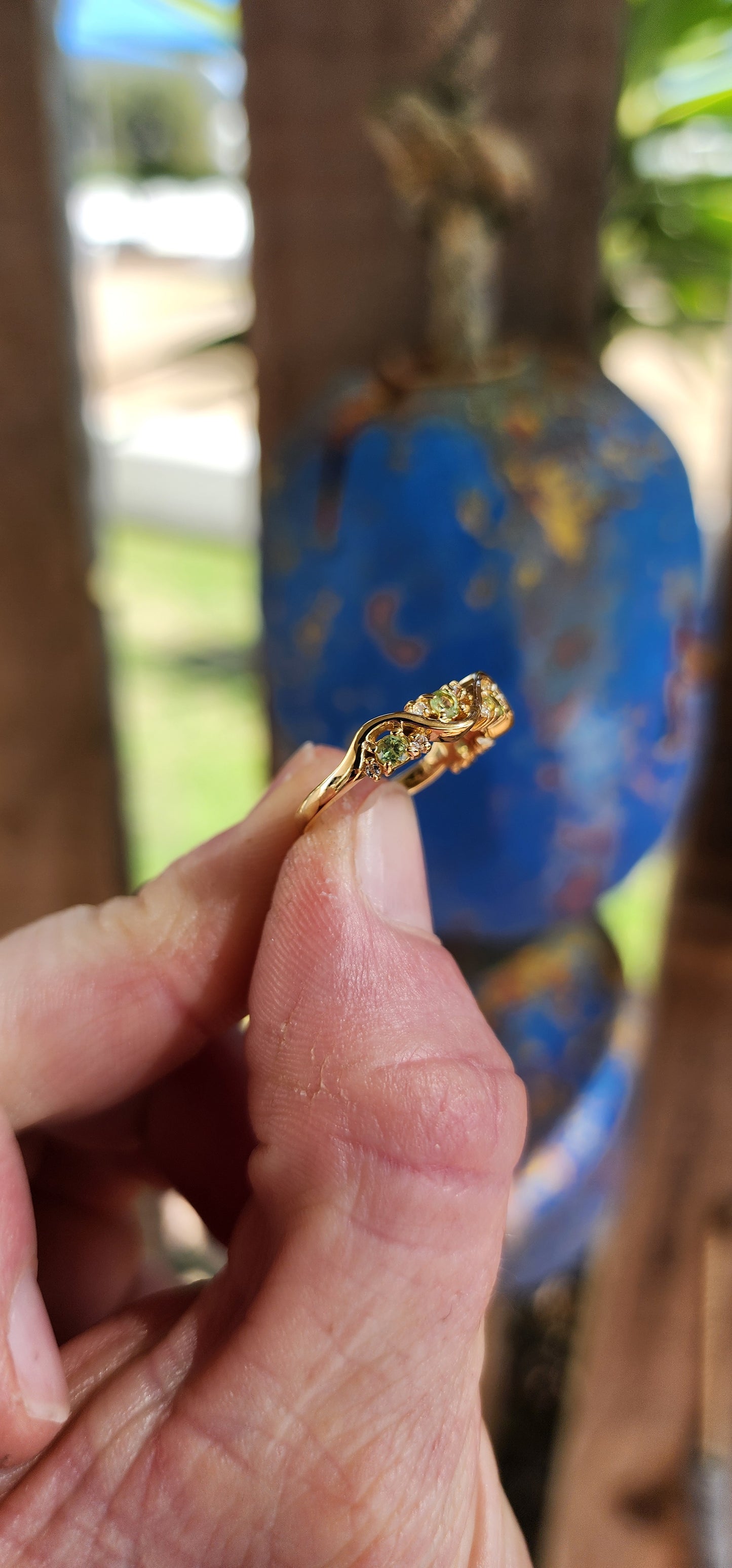 This captivating half-eternity ring is an elegant fusion of fluid design and sunlit vitality, artfully crafted in sterling silver and luxuriously plated in glowing 18ct yellow gold.