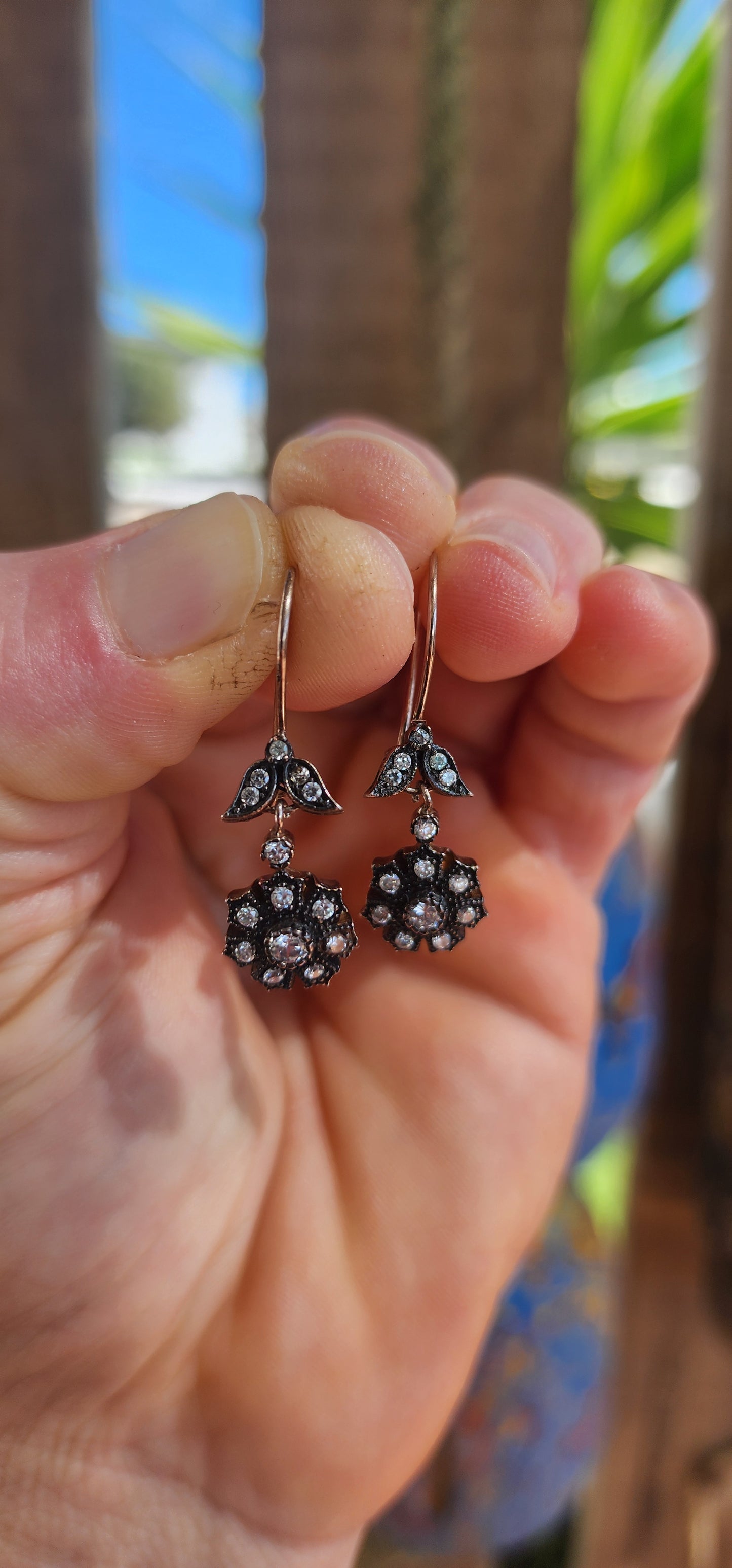 These elegant earrings are crafted in sterling silver and display a refined Victorian revival design that captures the romantic spirit of 19th-century jewelry.