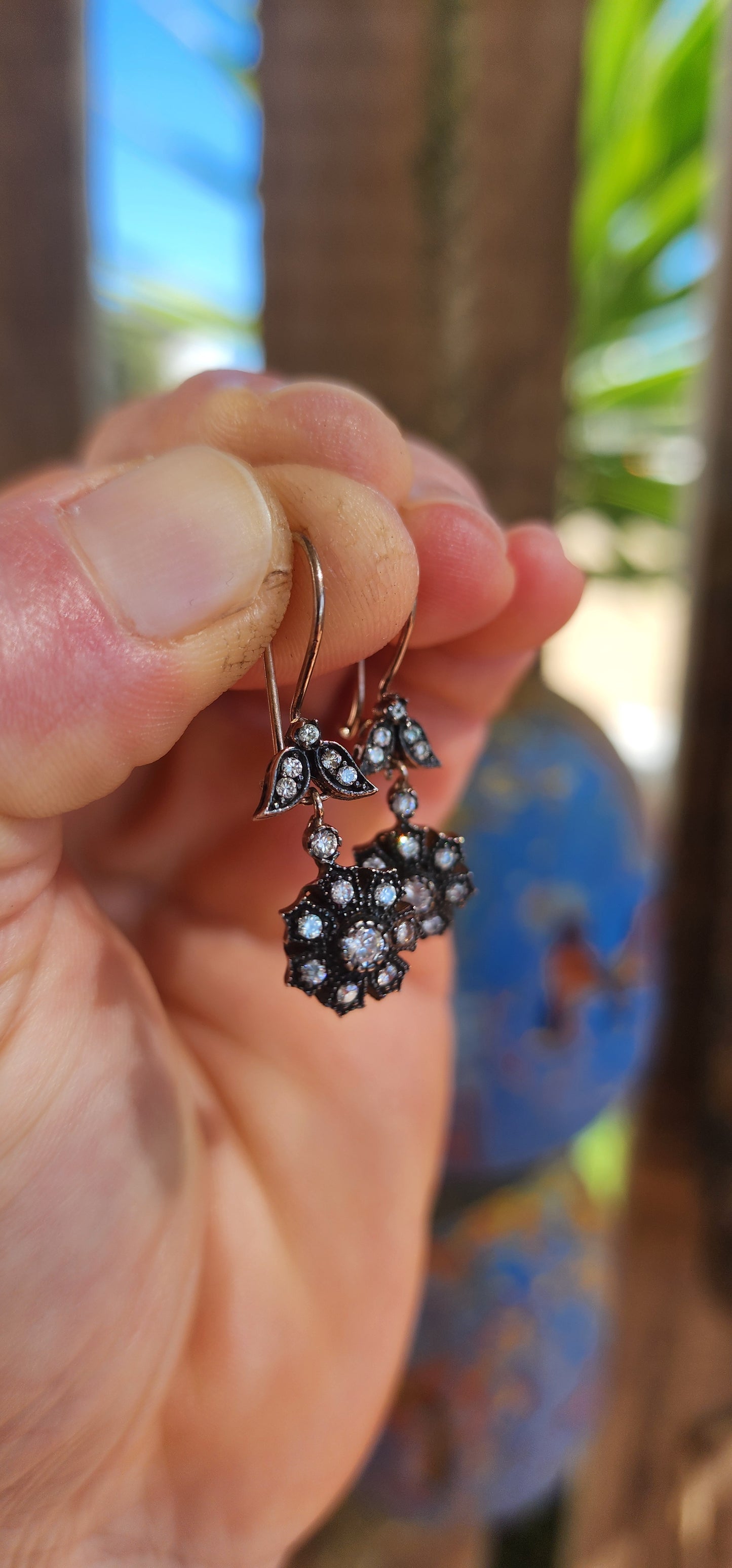 These elegant earrings are crafted in sterling silver and display a refined Victorian revival design that captures the romantic spirit of 19th-century jewelry.